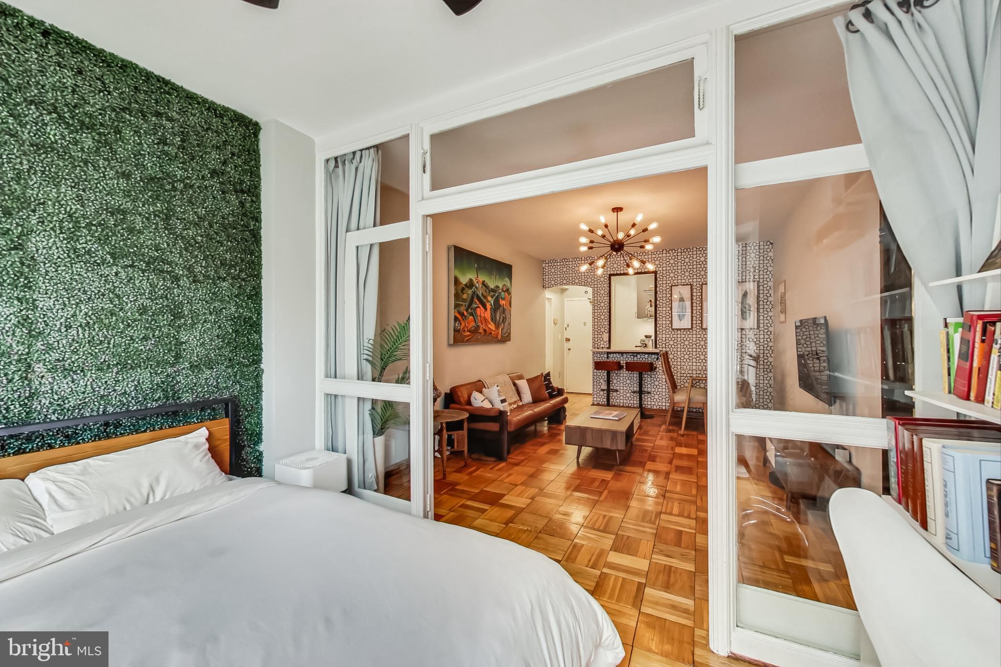 1 Scott Circle Northwest, Unit 20 Washington, DC 20005 - Photo 17 of 37 a bedroom with furniture and a large window