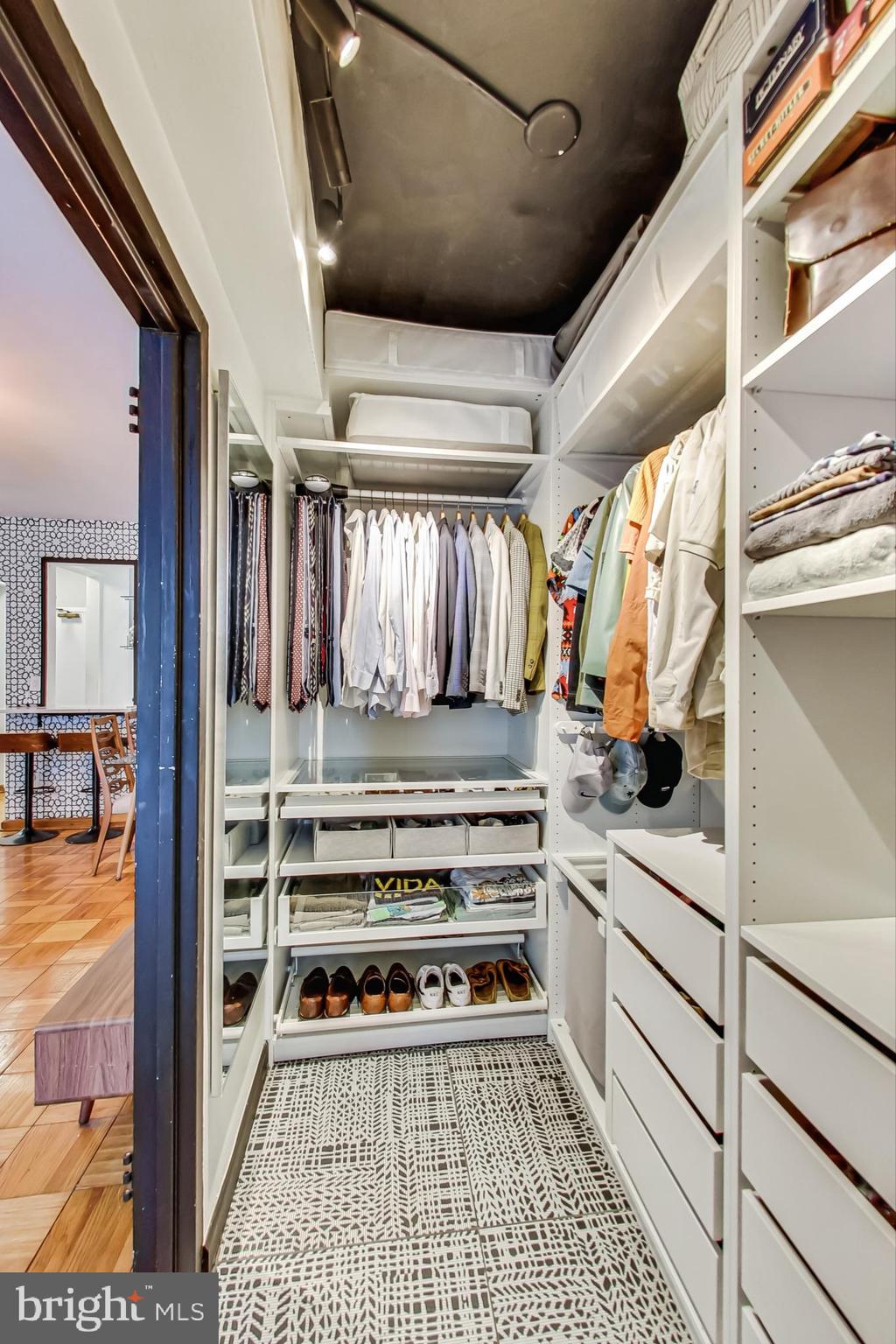 1 Scott Circle Northwest, Unit 20 Washington, DC 20005 - Photo 19 of 37 a view of walk in closet with clothes and shoes