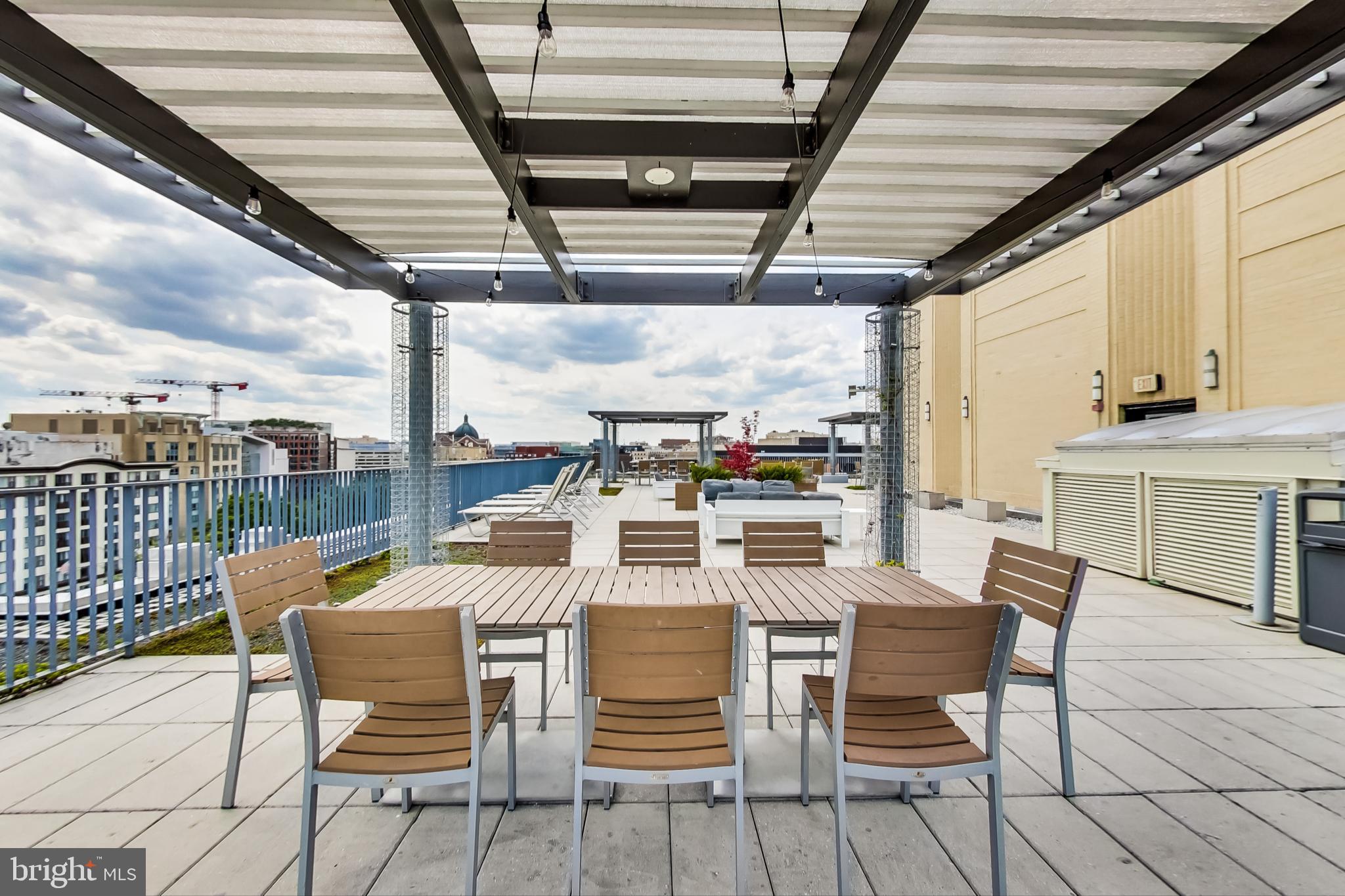 1 Scott Circle Northwest, Unit 20 Washington, DC 20005 - Photo 29 of 37 a view of a roof deck with table and chairs