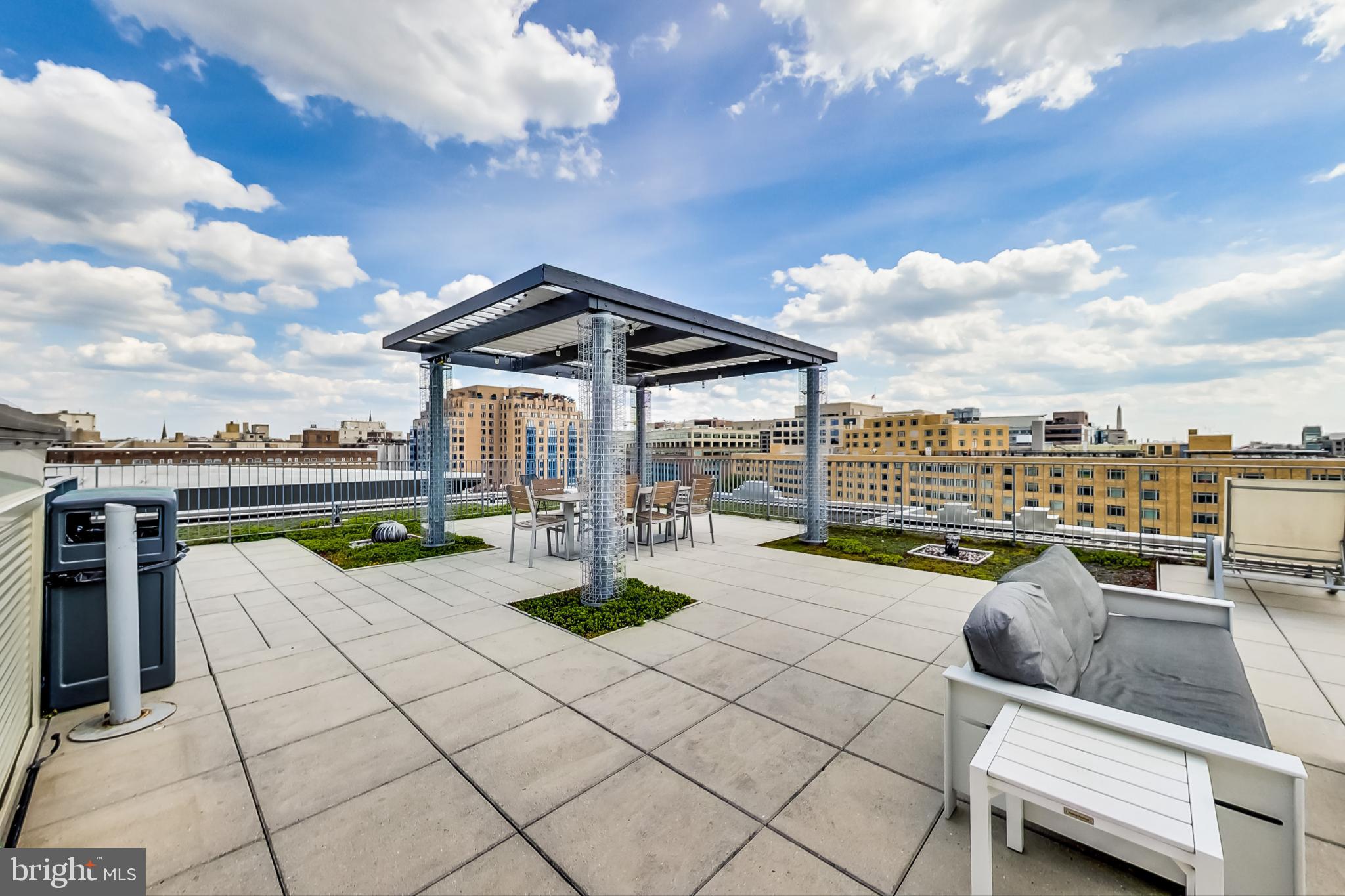 1 Scott Circle Northwest, Unit 20 Washington, DC 20005 - Photo 30 of 37 a swimming pool with outdoor seating and barbeque oven