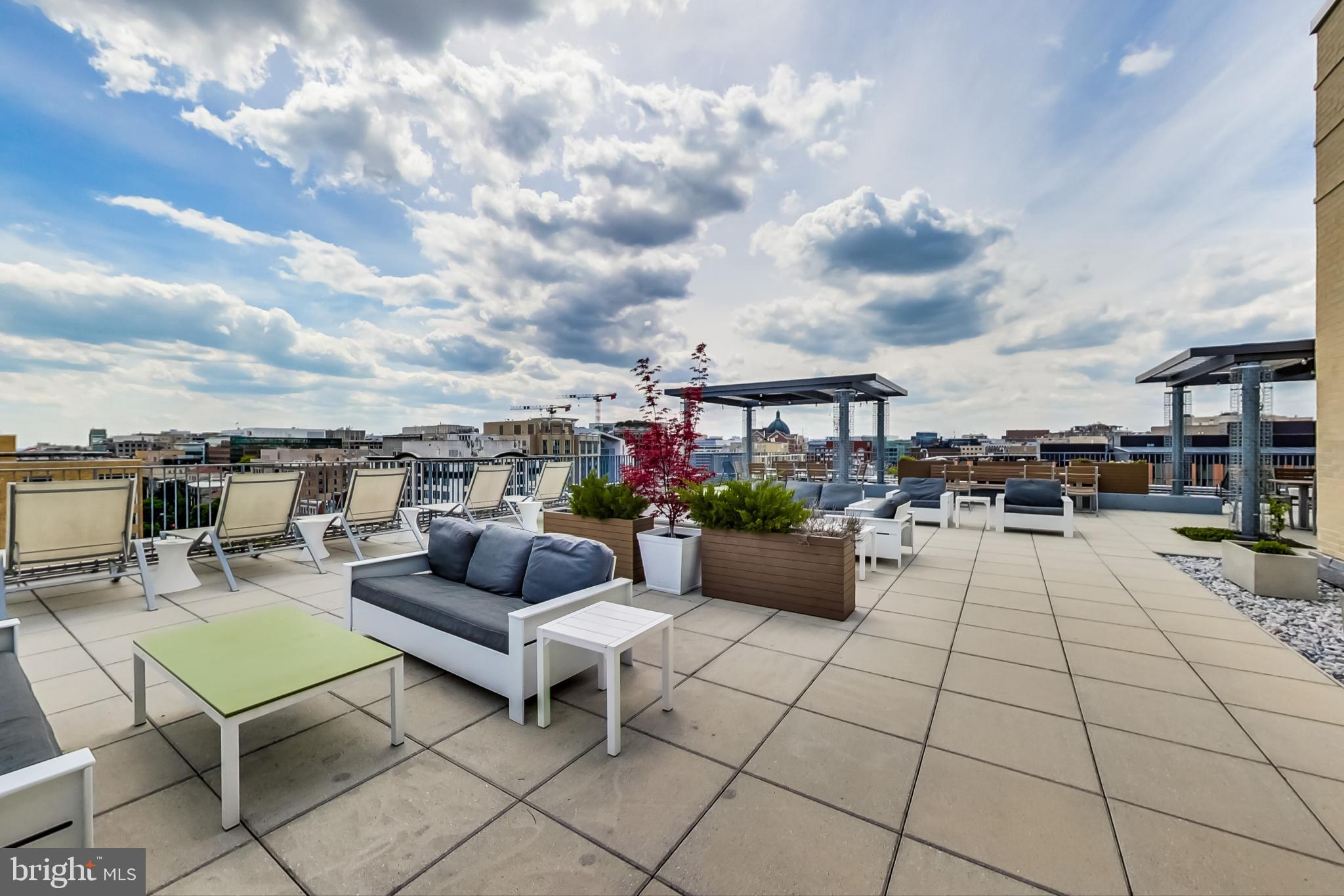 1 Scott Circle Northwest, Unit 20 Washington, DC 20005 - Photo 31 of 37 a view of roof deck with couches and potted plants
