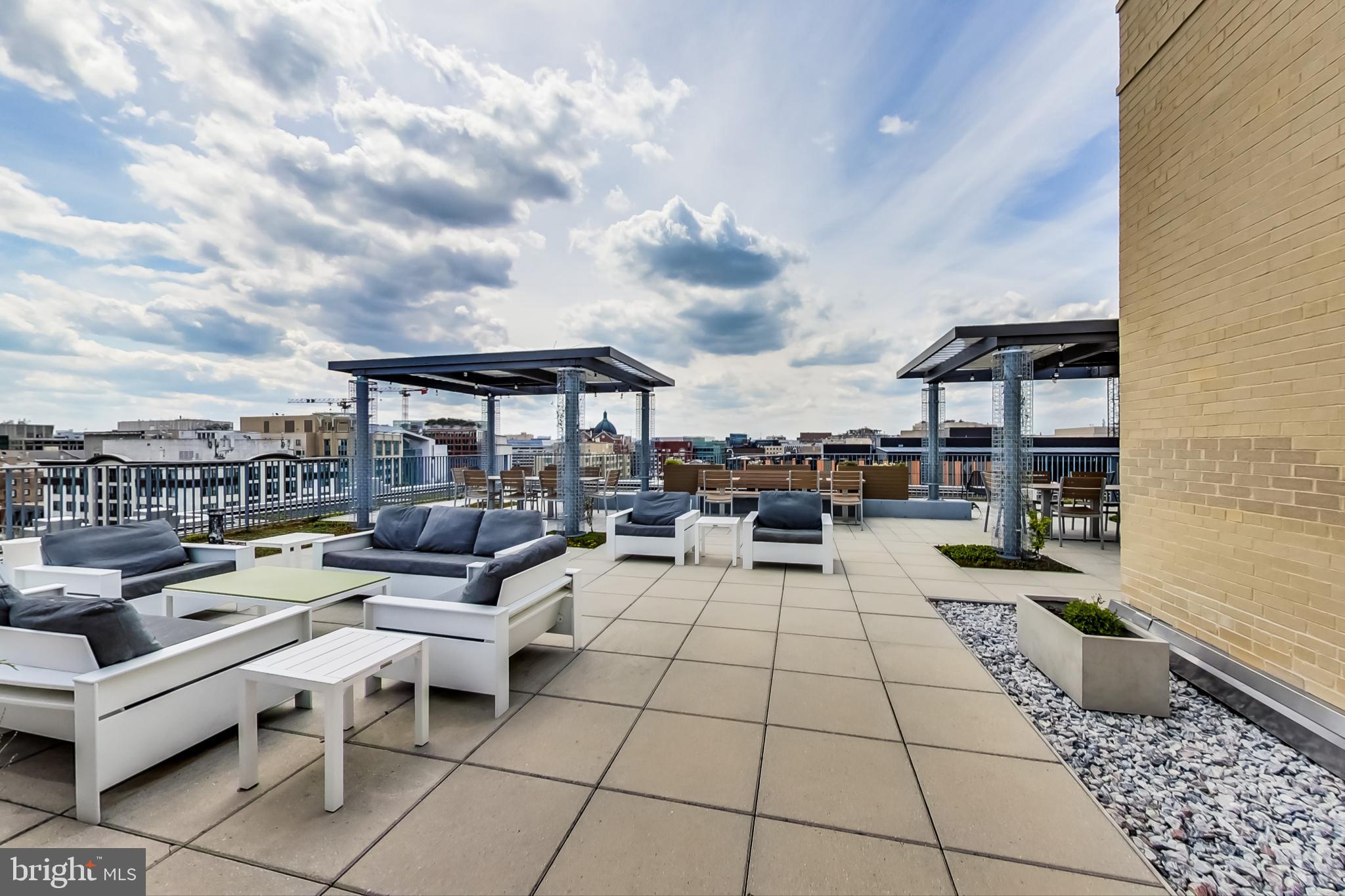 1 Scott Circle Northwest, Unit 20 Washington, DC 20005 - Photo 33 of 37 a living room with patio furniture and a rug