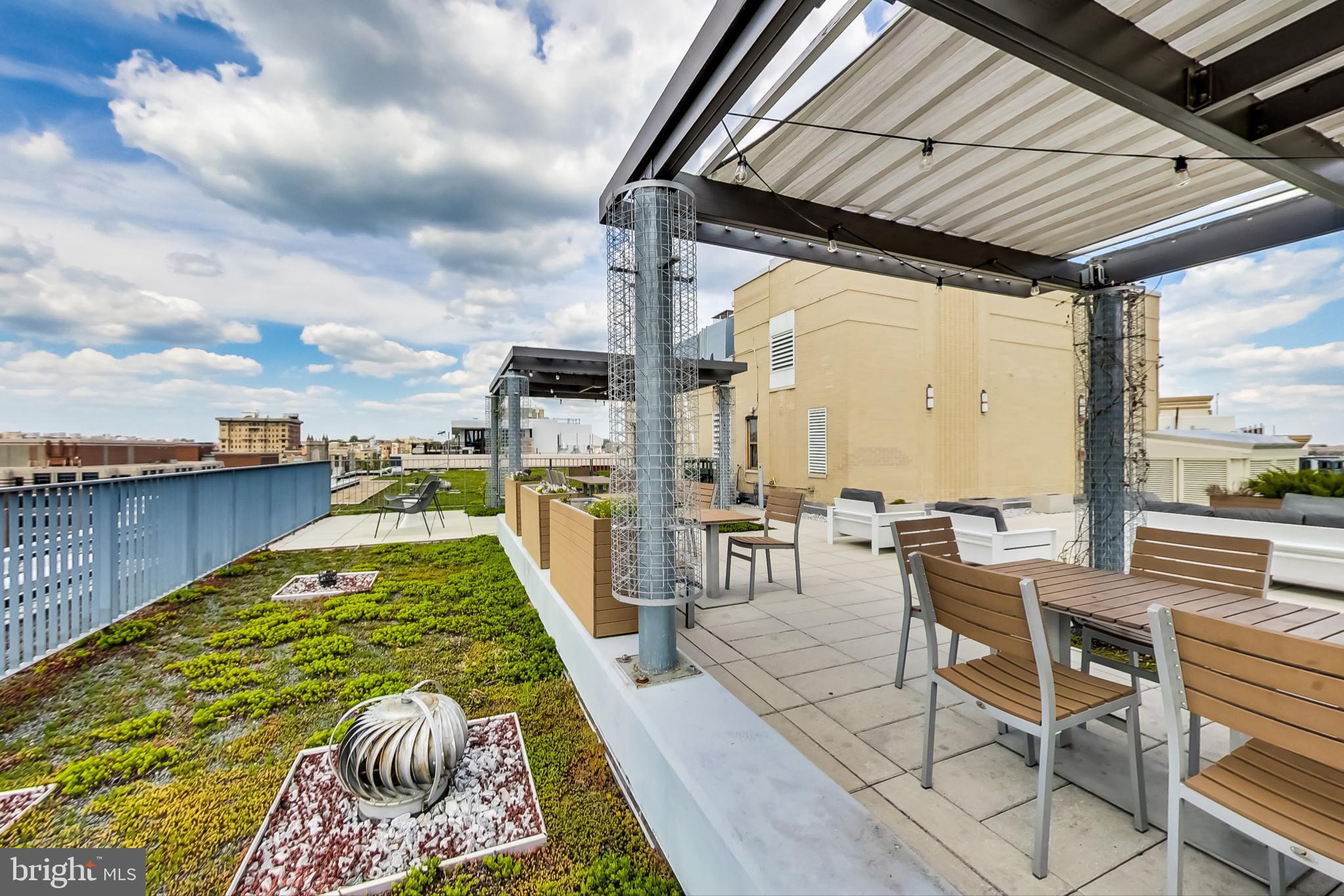 1 Scott Circle Northwest, Unit 20 Washington, DC 20005 - Photo 35 of 37 a view of a swimming pool with outdoor seating and plants