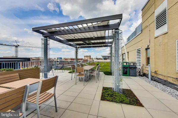 a view of a patio with a table and chairs