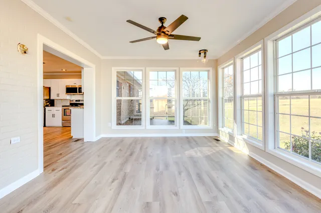 a bathroom with a granite countertop toilet and a sink