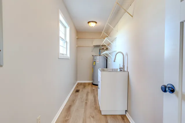 a view of a roof deck with wooden floor and fence