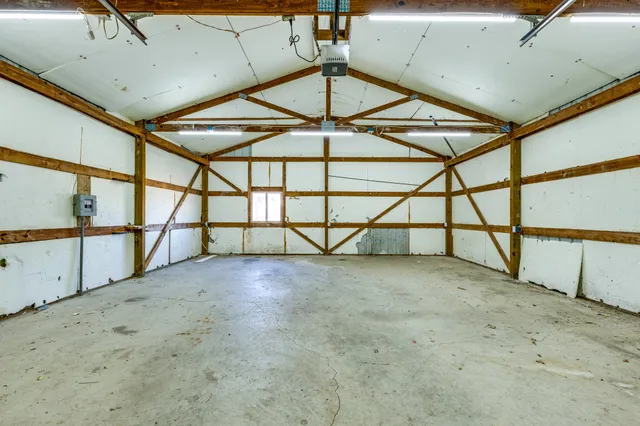 a view of a kitchen with a sink and cabinets