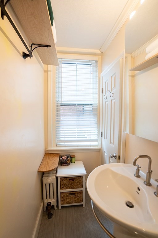 11 Irving Street, Unit 6 Boston, MA 02114 - Photo 12 of 14 a bathroom with a sink and a bathtub