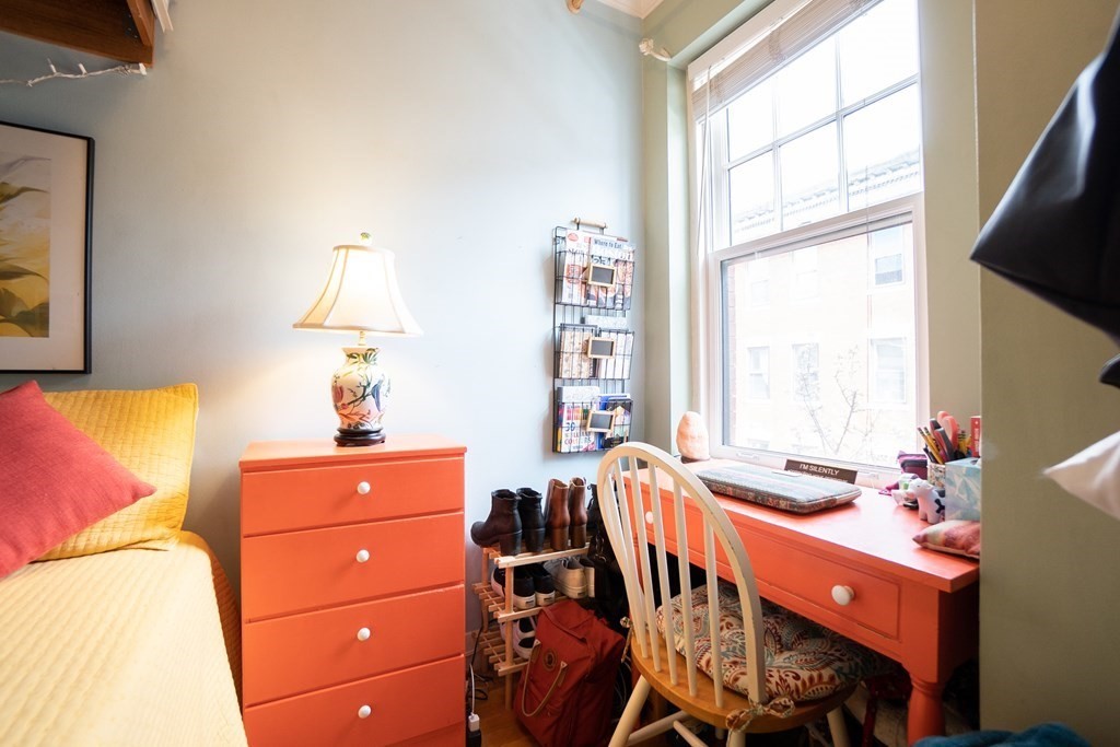 11 Irving Street, Unit 6 Boston, MA 02114 - Photo 9 of 14 a room with a bed and a window