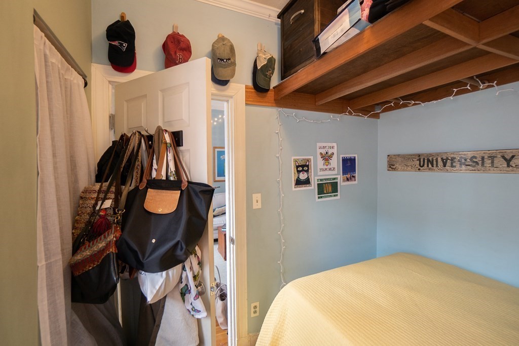 11 Irving Street, Unit 6 Boston, MA 02114 - Photo 10 of 14 a bedroom with a bed and cabinets