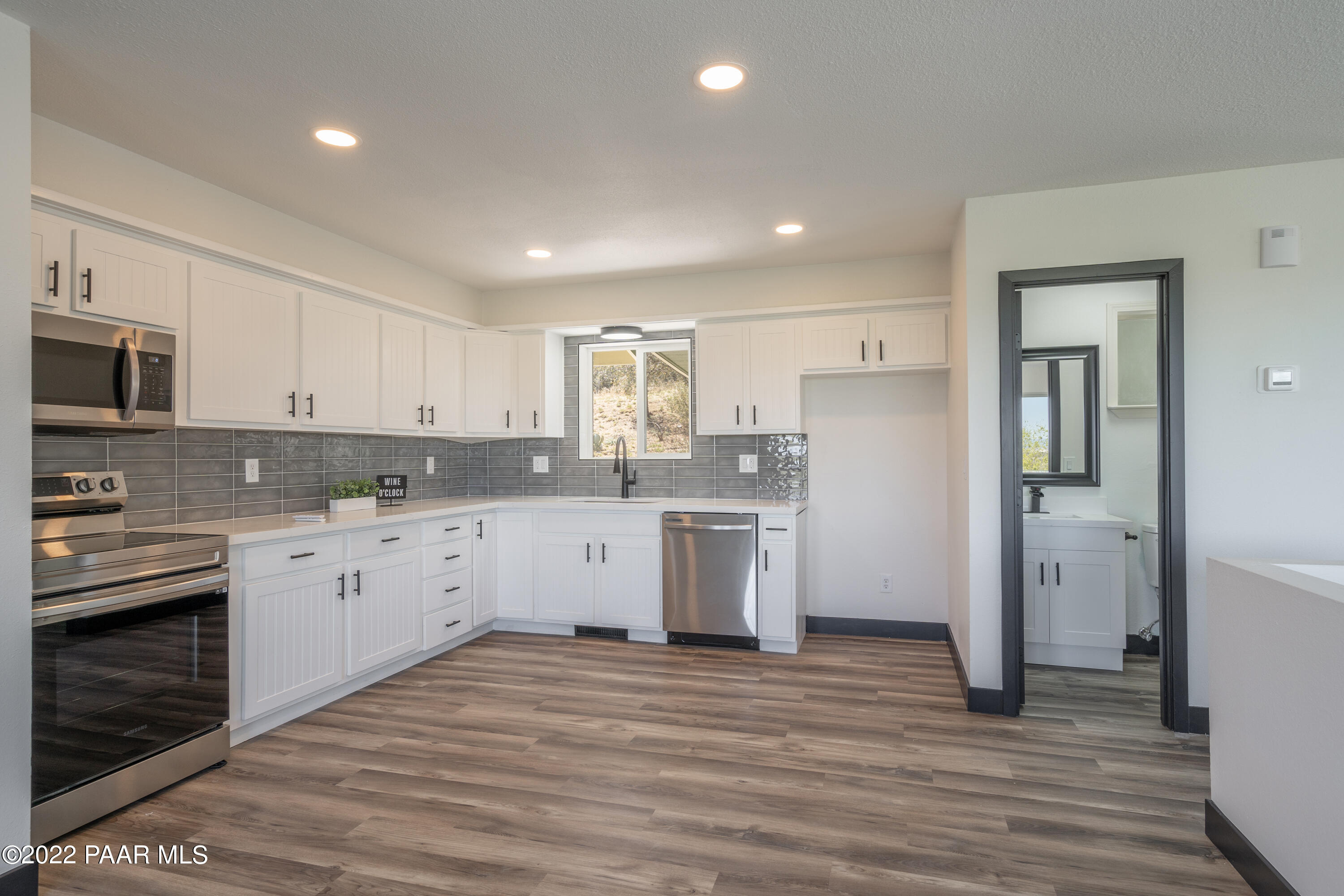 2615 Ridge Road Prescott, AZ 86301 - Photo 12 of 29 a kitchen with a white cabinets and refrigerator