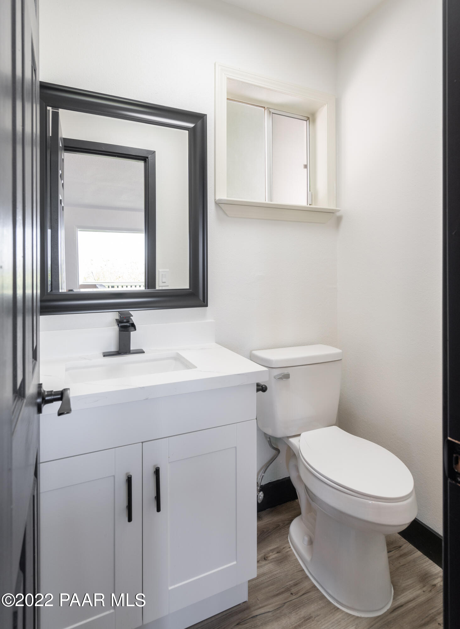 2615 Ridge Road Prescott, AZ 86301 - Photo 14 of 29 a bathroom with a toilet sink and mirror