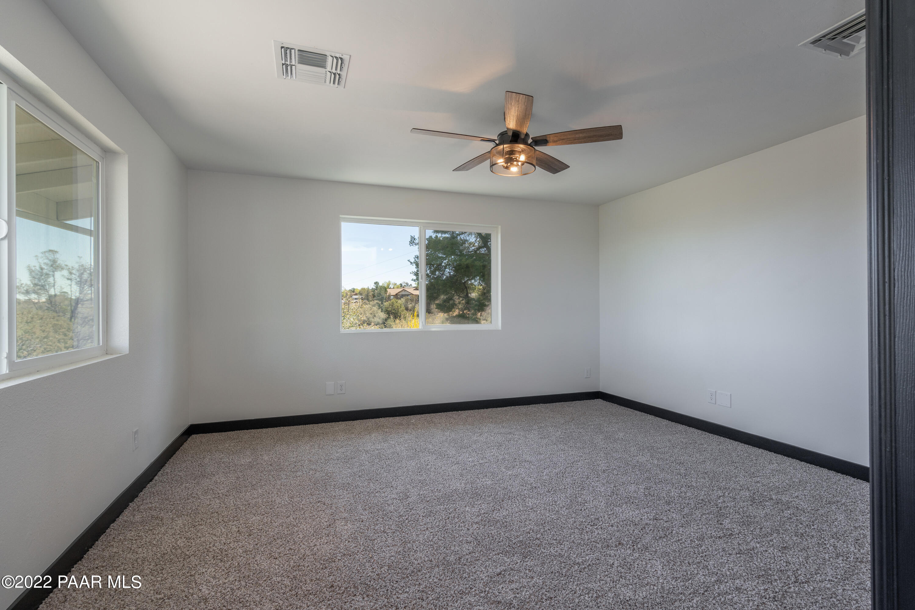2615 Ridge Road Prescott, AZ 86301 - Photo 15 of 29 an empty room with windows and ceiling fan
