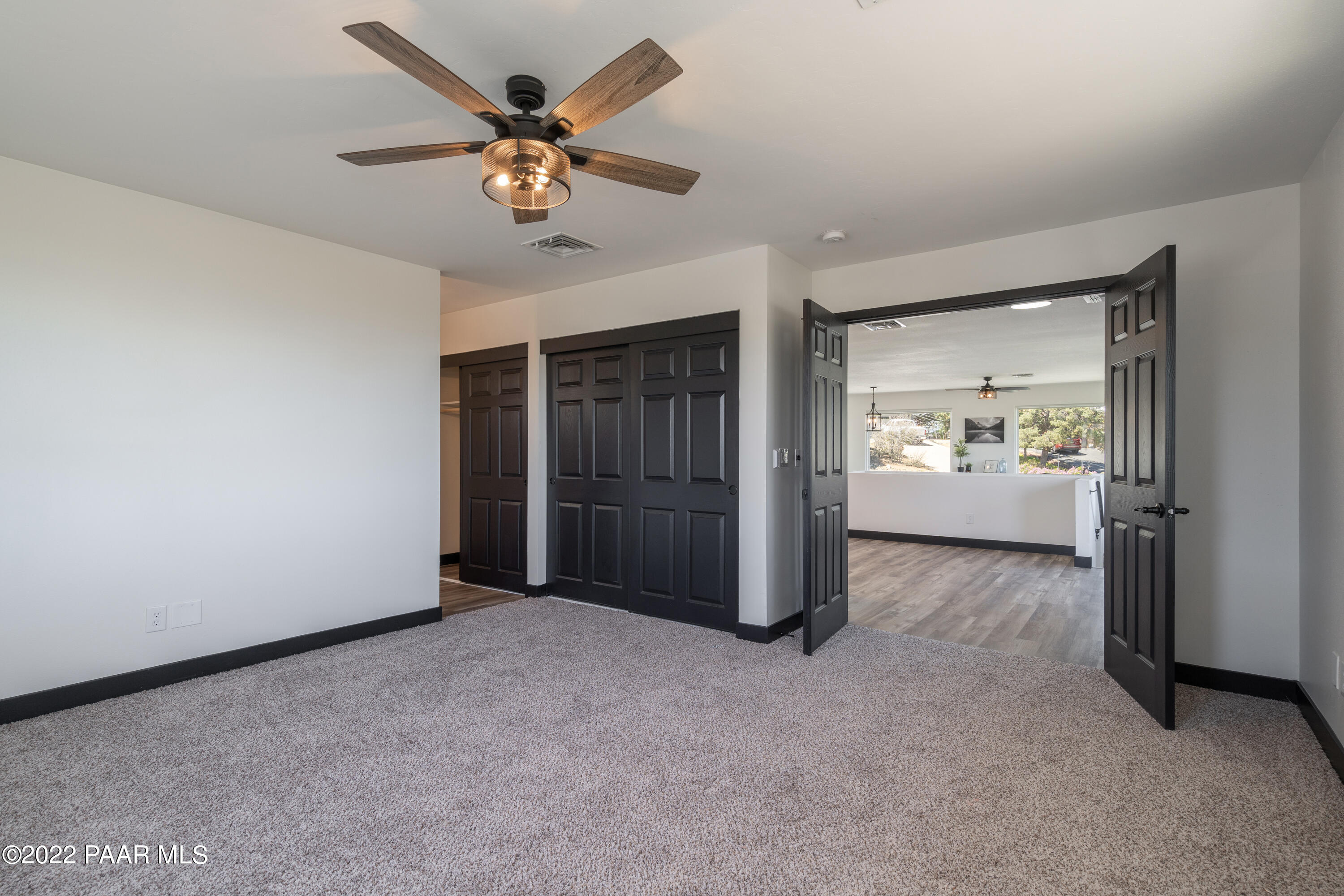 2615 Ridge Road Prescott, AZ 86301 - Photo 16 of 29 a view of an empty room with a ceiling fan and window