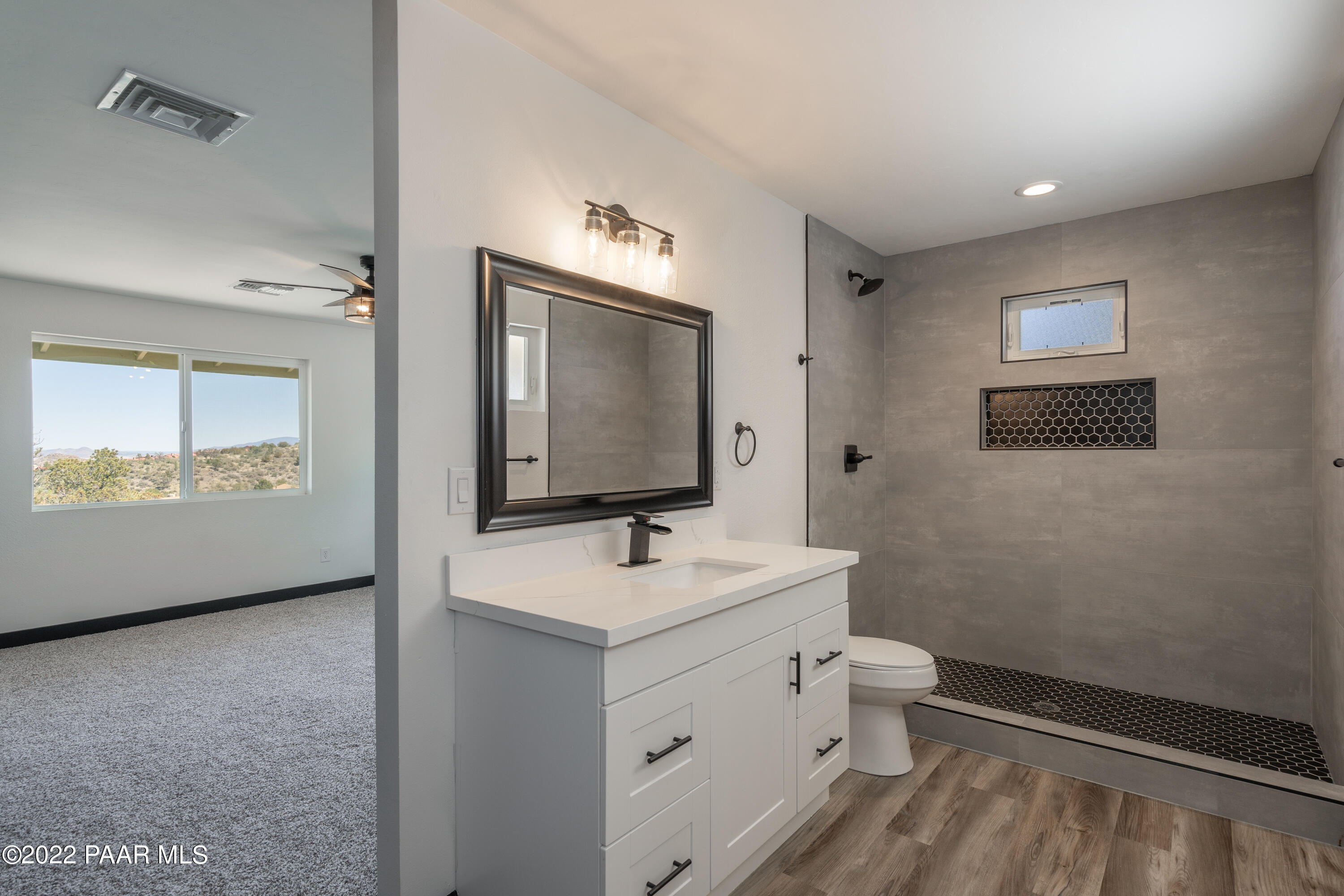 2615 Ridge Road Prescott, AZ 86301 - Photo 17 of 29 a bathroom with a toilet sink and mirror