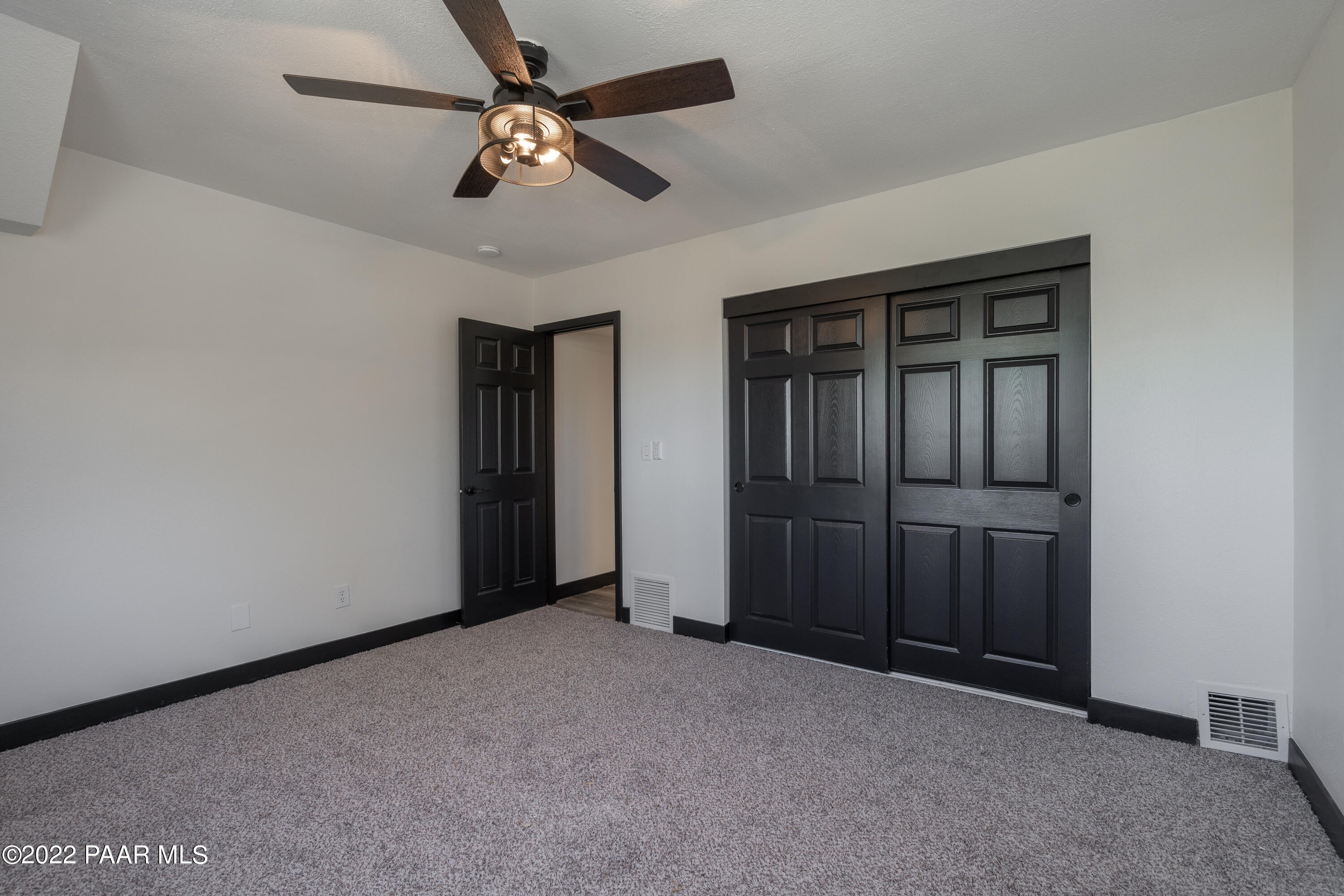 2615 Ridge Road Prescott, AZ 86301 - Photo 22 of 29 an empty room with closet and windows