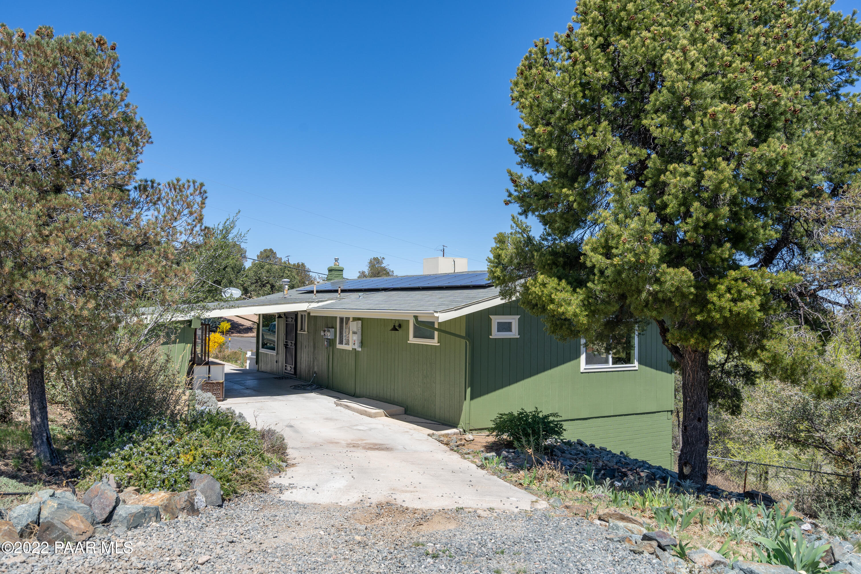 2615 Ridge Road Prescott, AZ 86301 - Photo 7 of 29 a front view of a house with a garden
