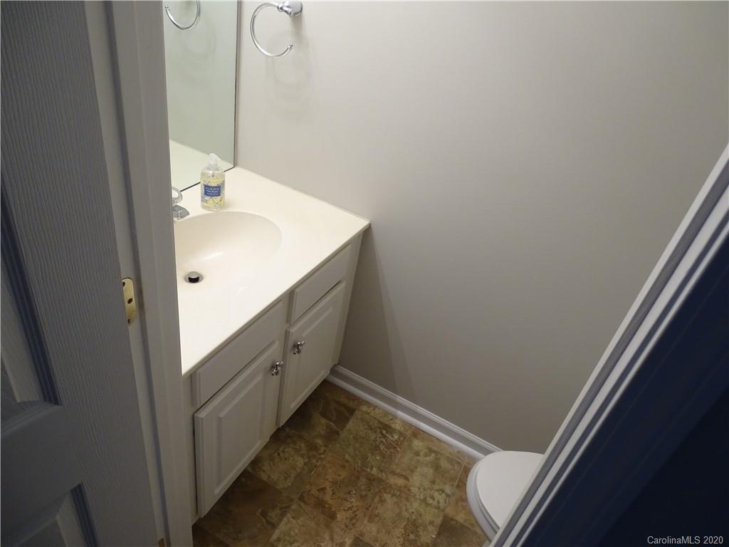 6929 Rothchild Drive Charlotte, NC 28270 - Photo 11 of 20 a bathroom with a sink and a mirror