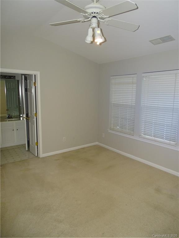 6929 Rothchild Drive Charlotte, NC 28270 - Photo 12 of 20 an empty room with chandelier fan
