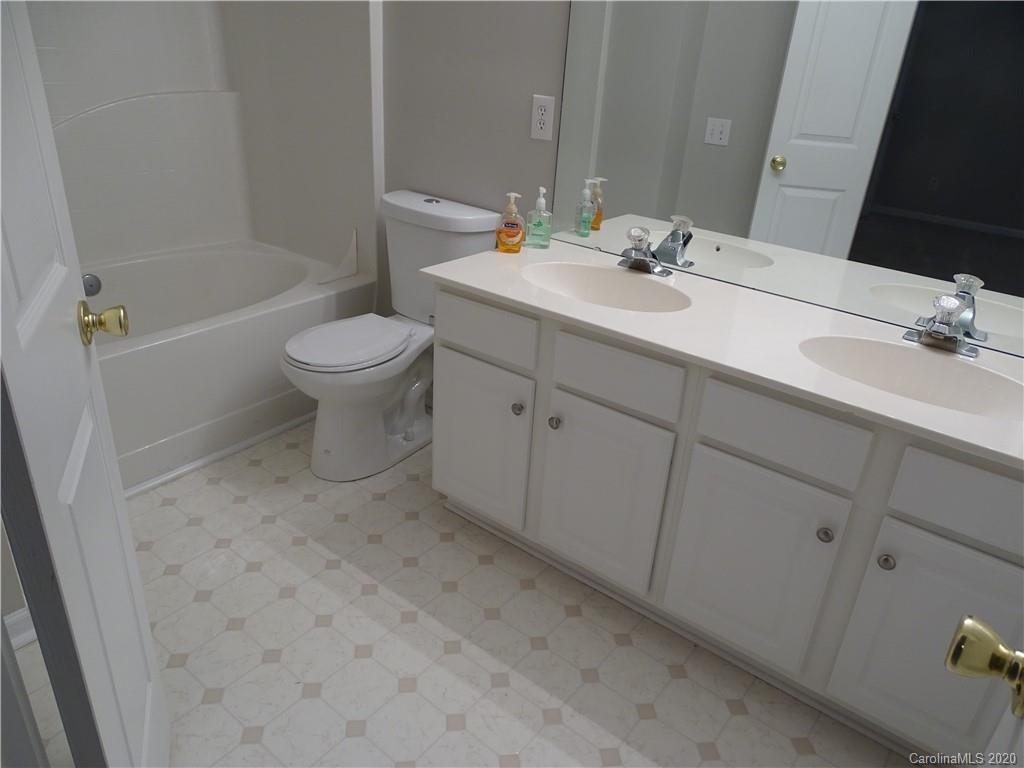 6929 Rothchild Drive Charlotte, NC 28270 - Photo 14 of 20 a bathroom with a sink toilet and shower