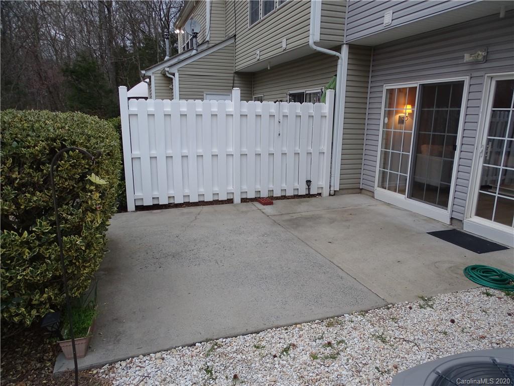 6929 Rothchild Drive Charlotte, NC 28270 - Photo 4 of 20 a view of a house with a wooden fence