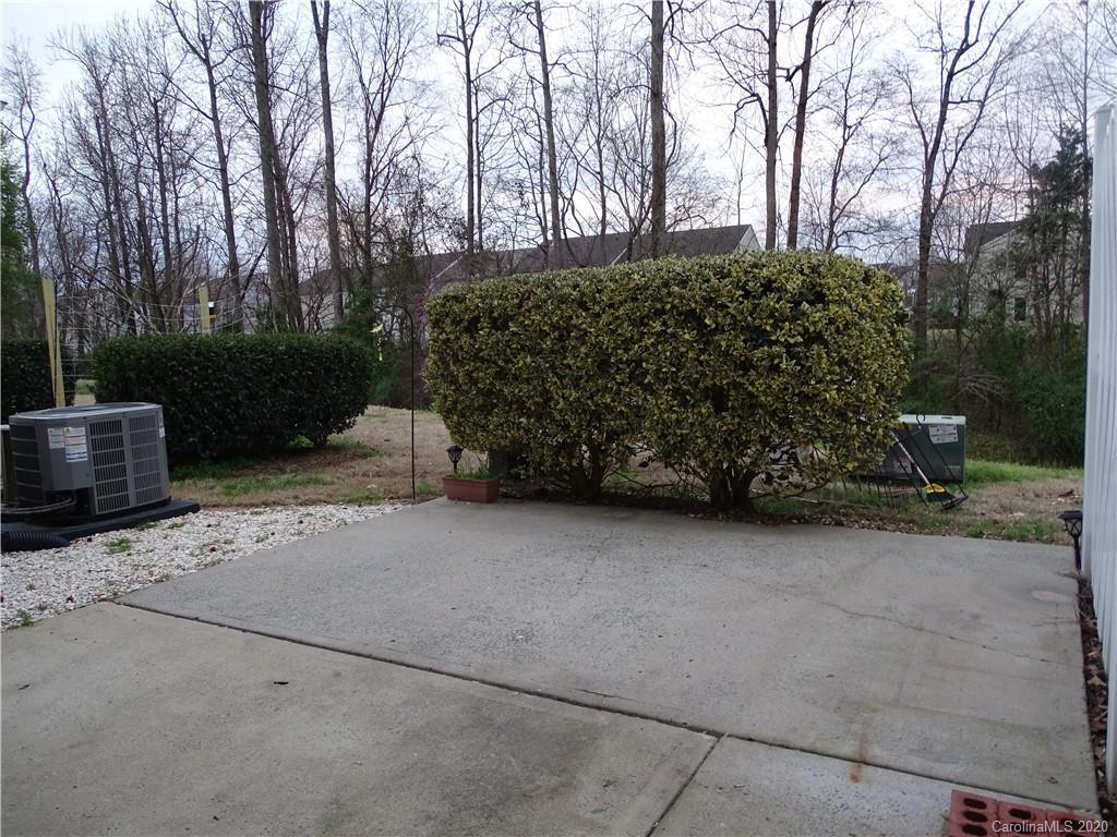 6929 Rothchild Drive Charlotte, NC 28270 - Photo 6 of 20 a backyard of a house with lots of green space