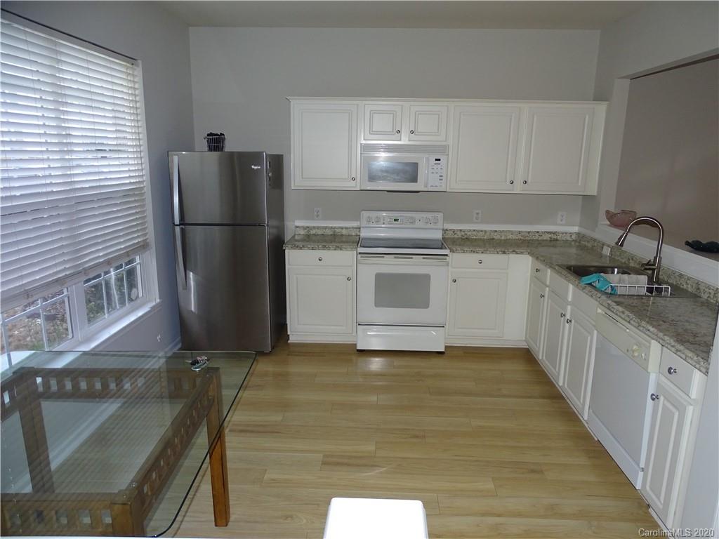 6929 Rothchild Drive Charlotte, NC 28270 - Photo 7 of 20 a kitchen with a refrigerator sink and stove