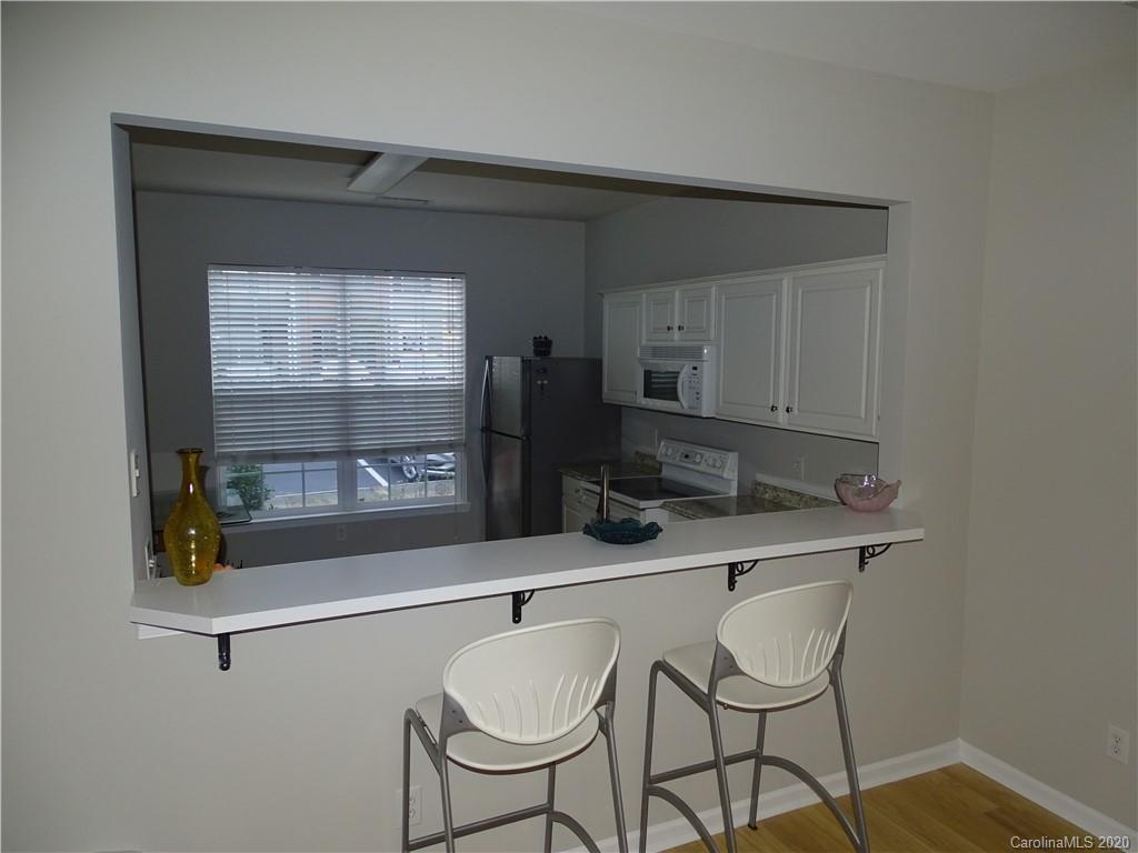 6929 Rothchild Drive Charlotte, NC 28270 - Photo 9 of 20 a kitchen with a table and chairs