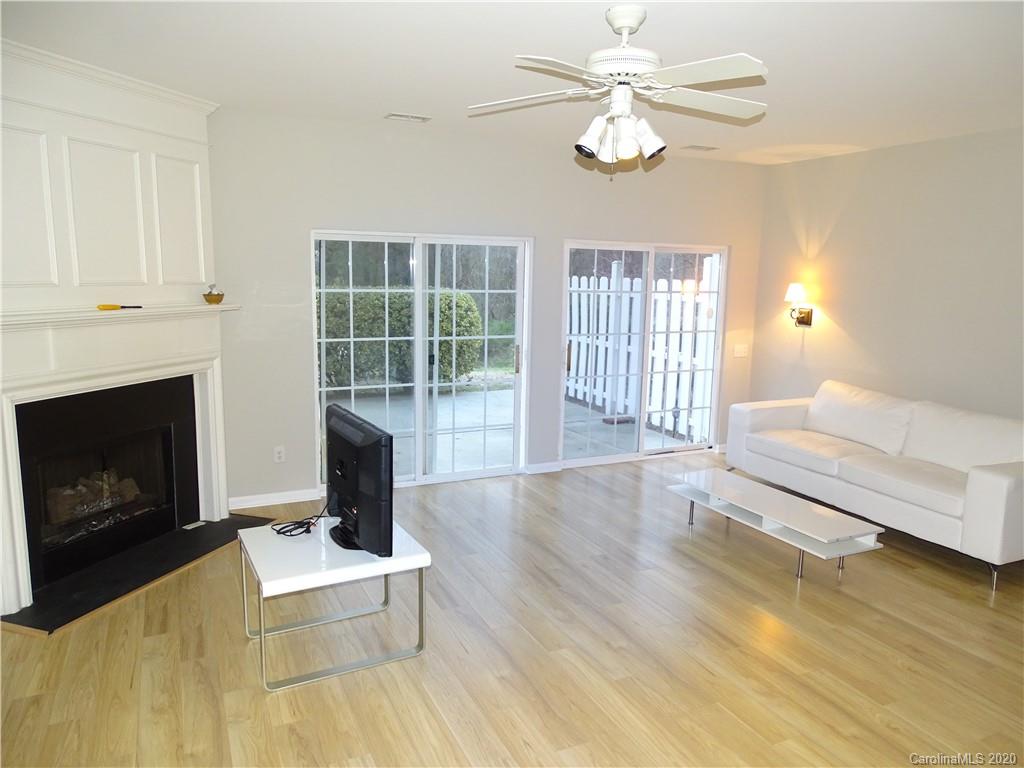 6929 Rothchild Drive Charlotte, NC 28270 - Photo 10 of 20 a living room with furniture and a fireplace