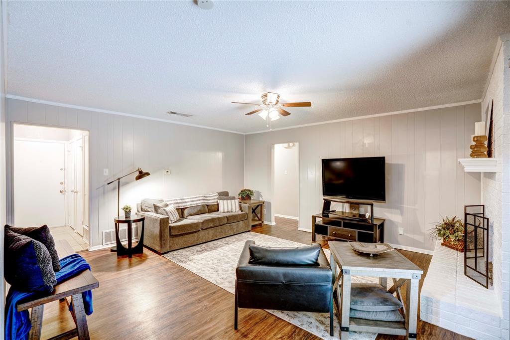 6028 Ridgecrest Drive Watauga, TX 76148 - Photo 8 of 40 a living room with furniture and a flat screen tv