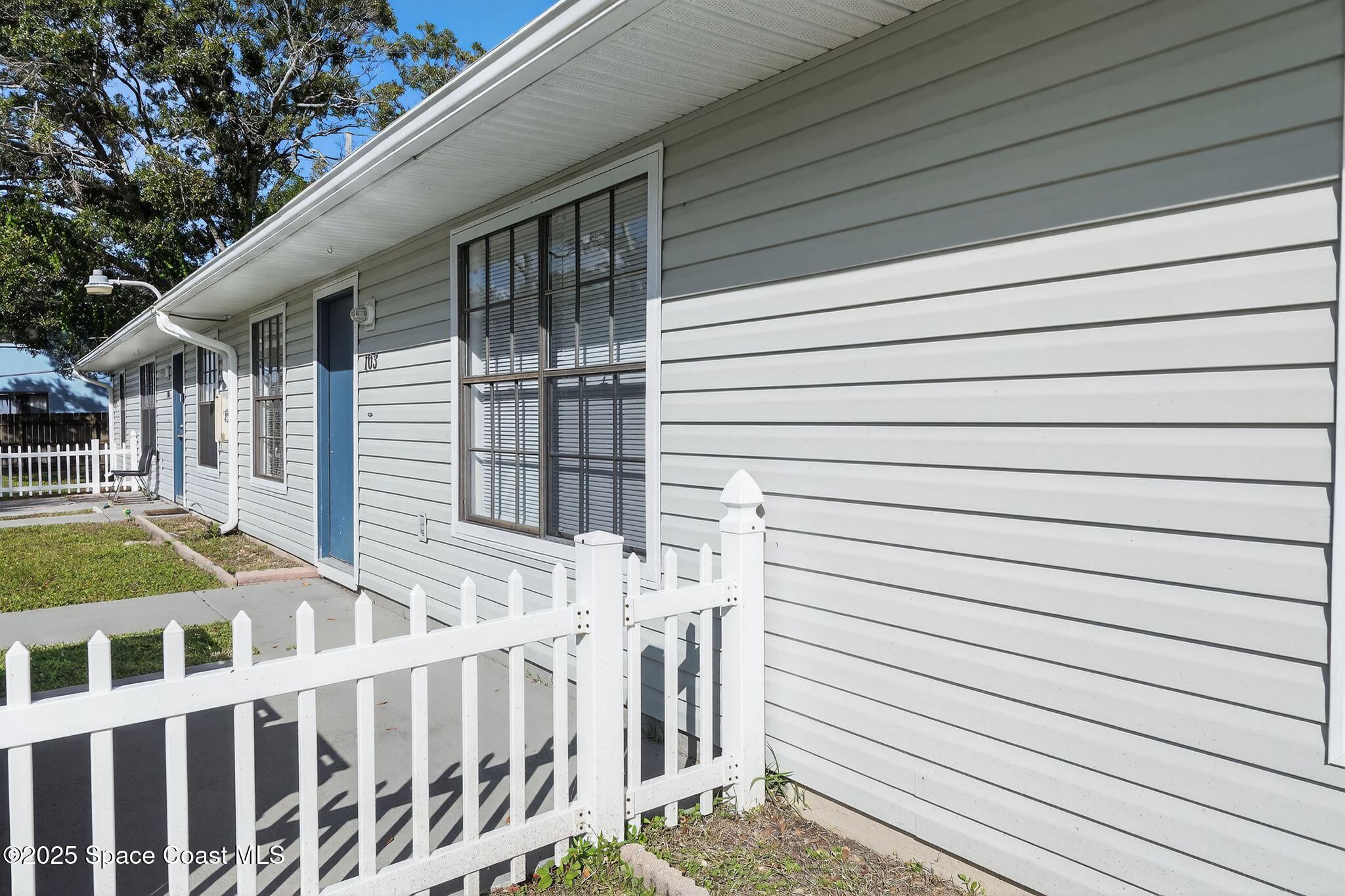 410 Thor Avenue Southeast, Unit 103 Palm Bay, FL 32909 - Photo 3 of 19 a view of a house with a deck