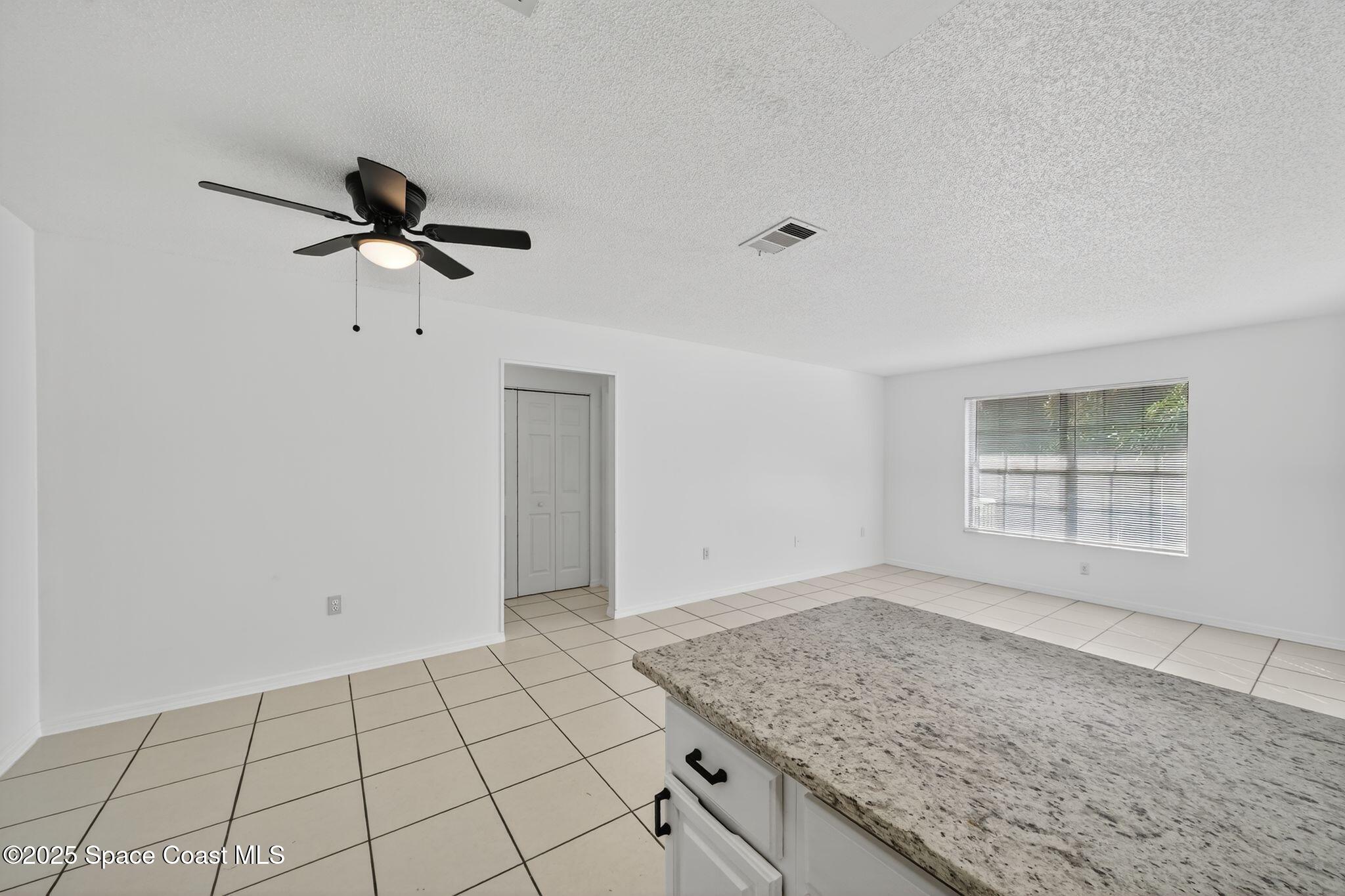 410 Thor Avenue Southeast, Unit 103 Palm Bay, FL 32909 - Photo 10 of 19 a view of an empty room and window