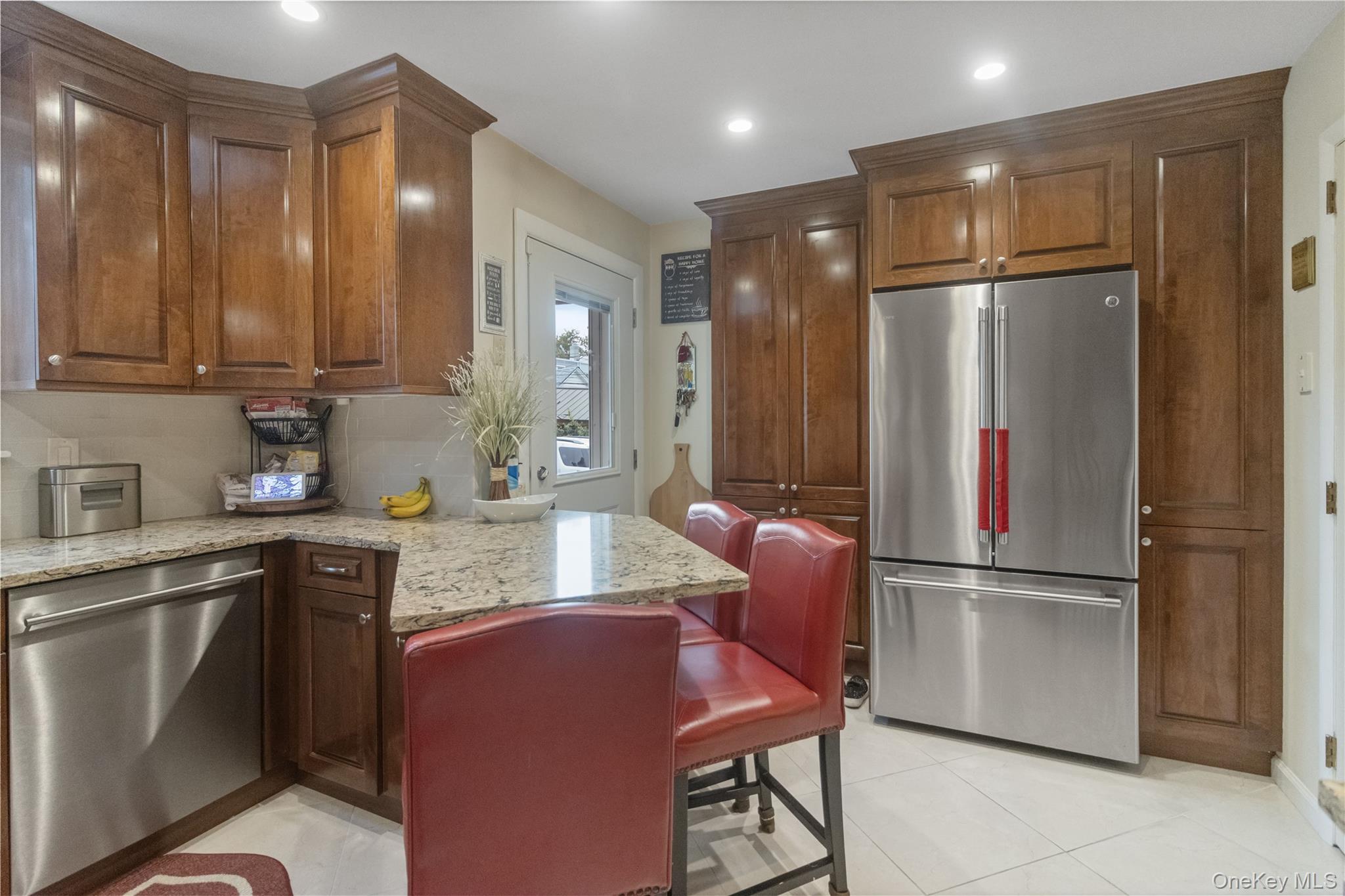 69-24 68th Place Queens, NY 11385 - Photo 11 of 26 a kitchen with refrigerator cabinets and a sink