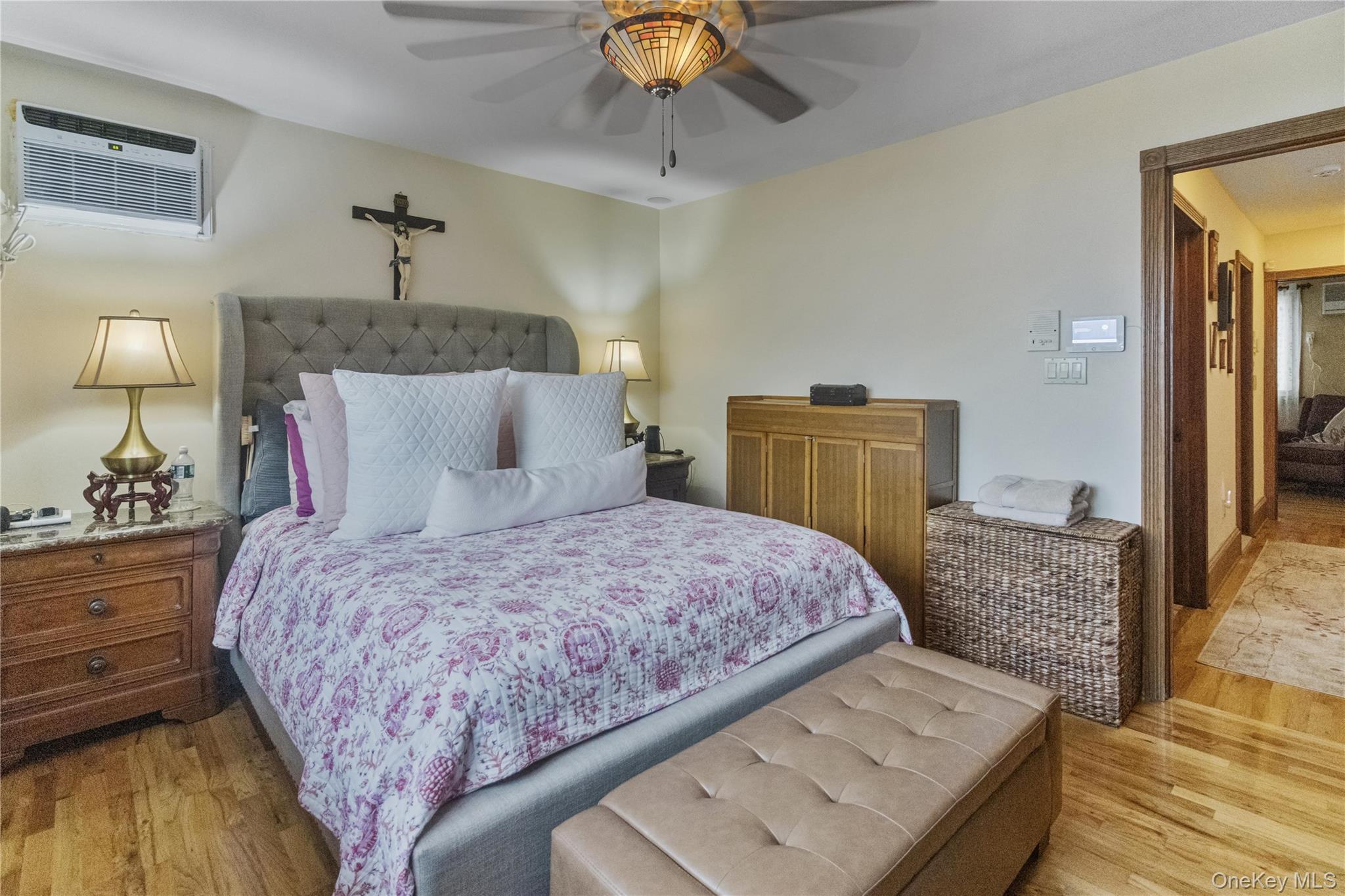 69-24 68th Place Queens, NY 11385 - Photo 13 of 26 a bedroom with a bed and wooden floor