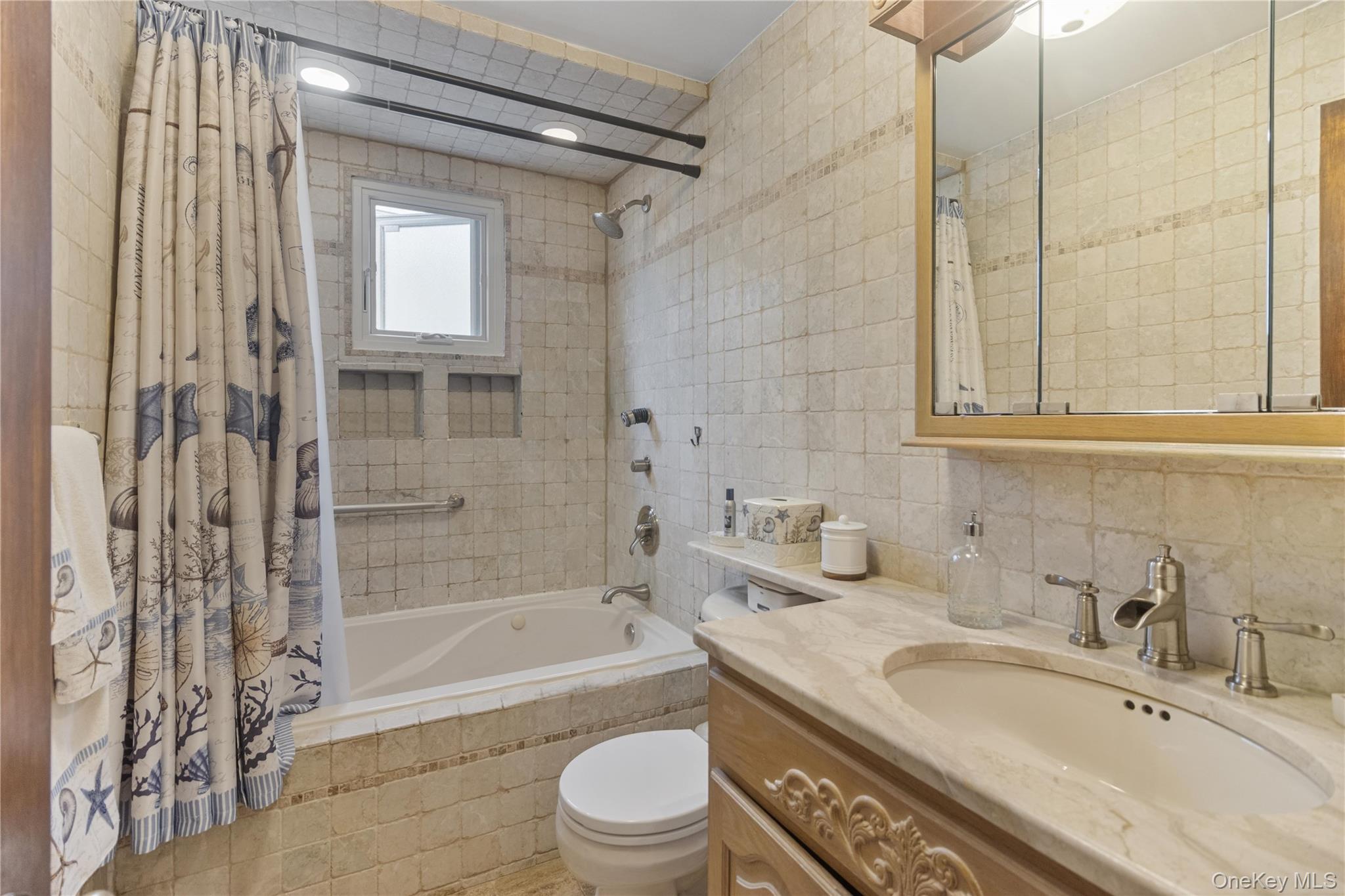 69-24 68th Place Queens, NY 11385 - Photo 17 of 26 a bathroom with a granite countertop sink toilet and shower