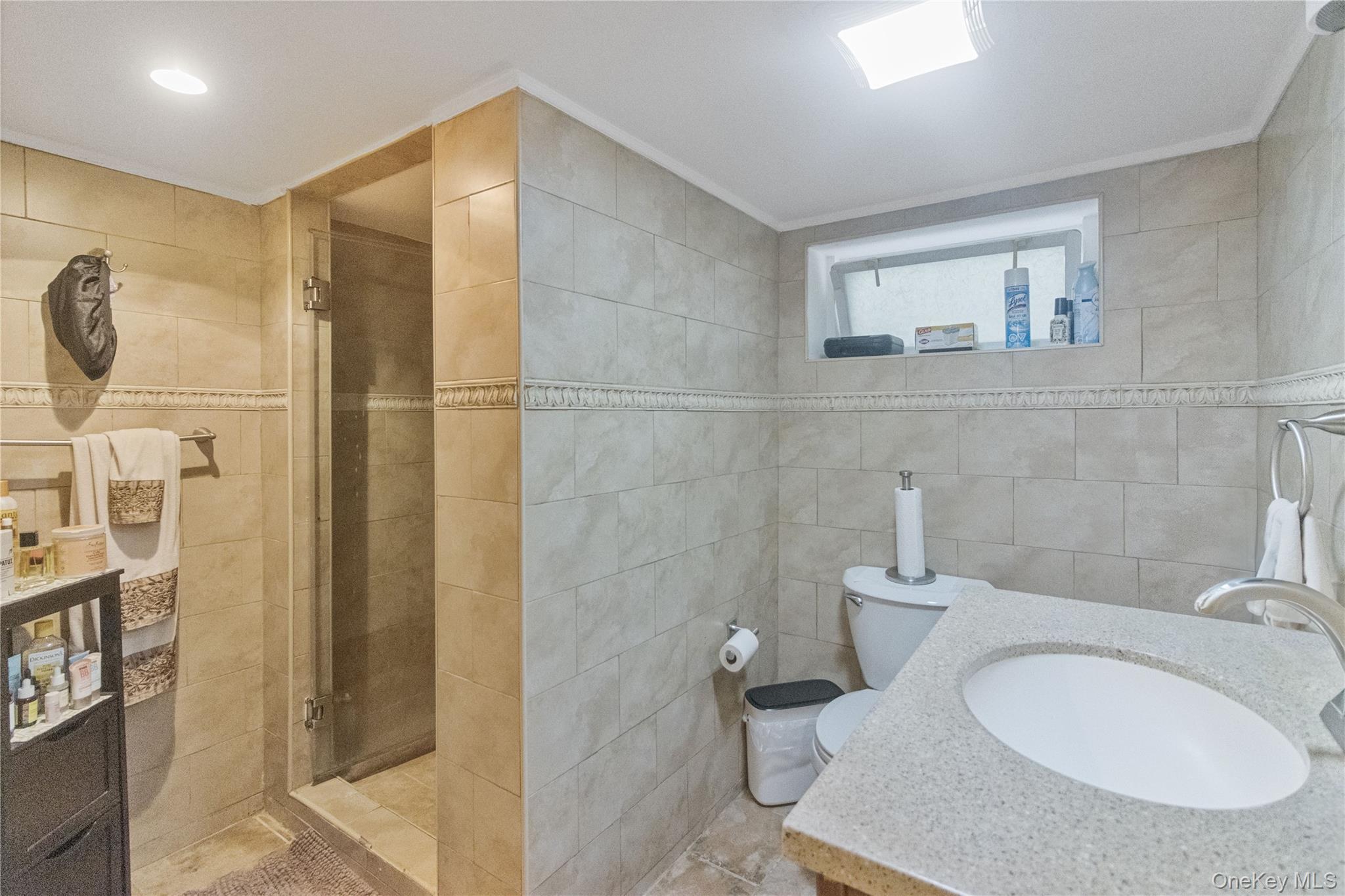 69-24 68th Place Queens, NY 11385 - Photo 19 of 26 a bathroom with a sink toilet and shower