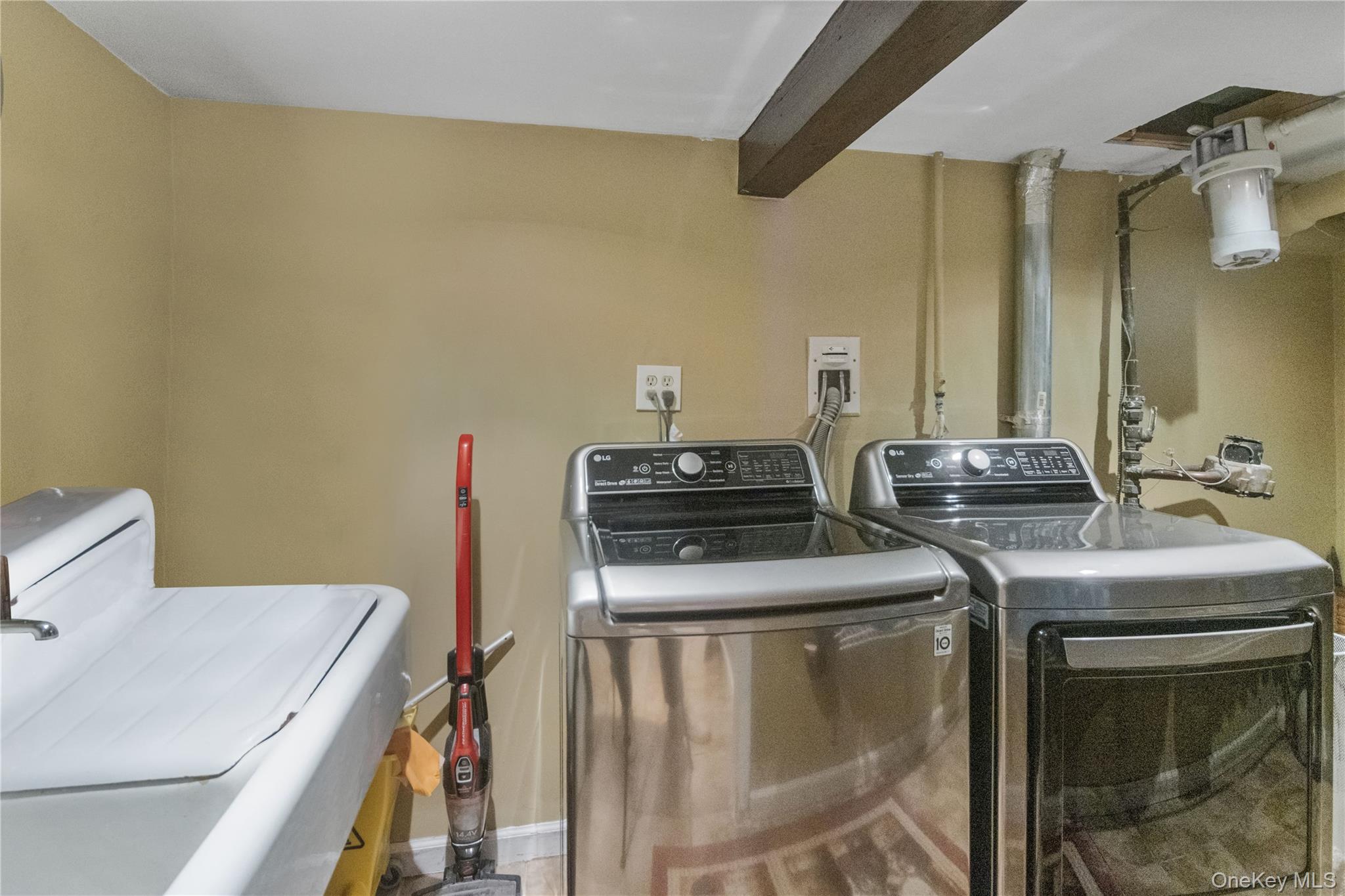 69-24 68th Place Queens, NY 11385 - Photo 20 of 26 a utility room with dryer and washer