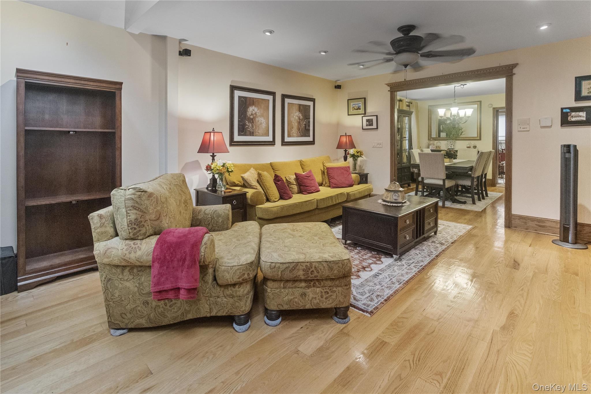 69-24 68th Place Queens, NY 11385 - Photo 3 of 26 a living room with furniture and a wooden floor