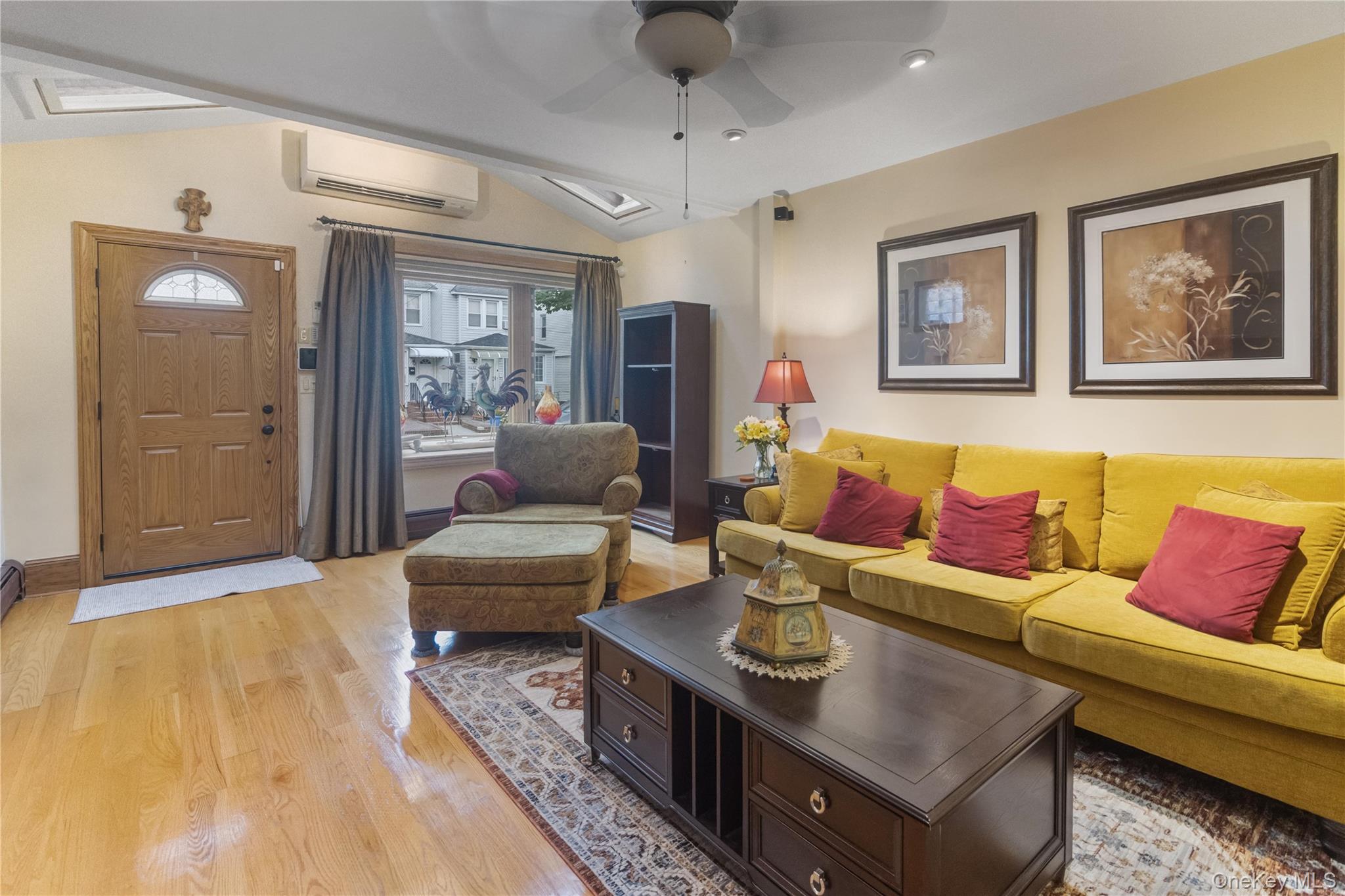69-24 68th Place Queens, NY 11385 - Photo 4 of 26 a living room with furniture and a large window
