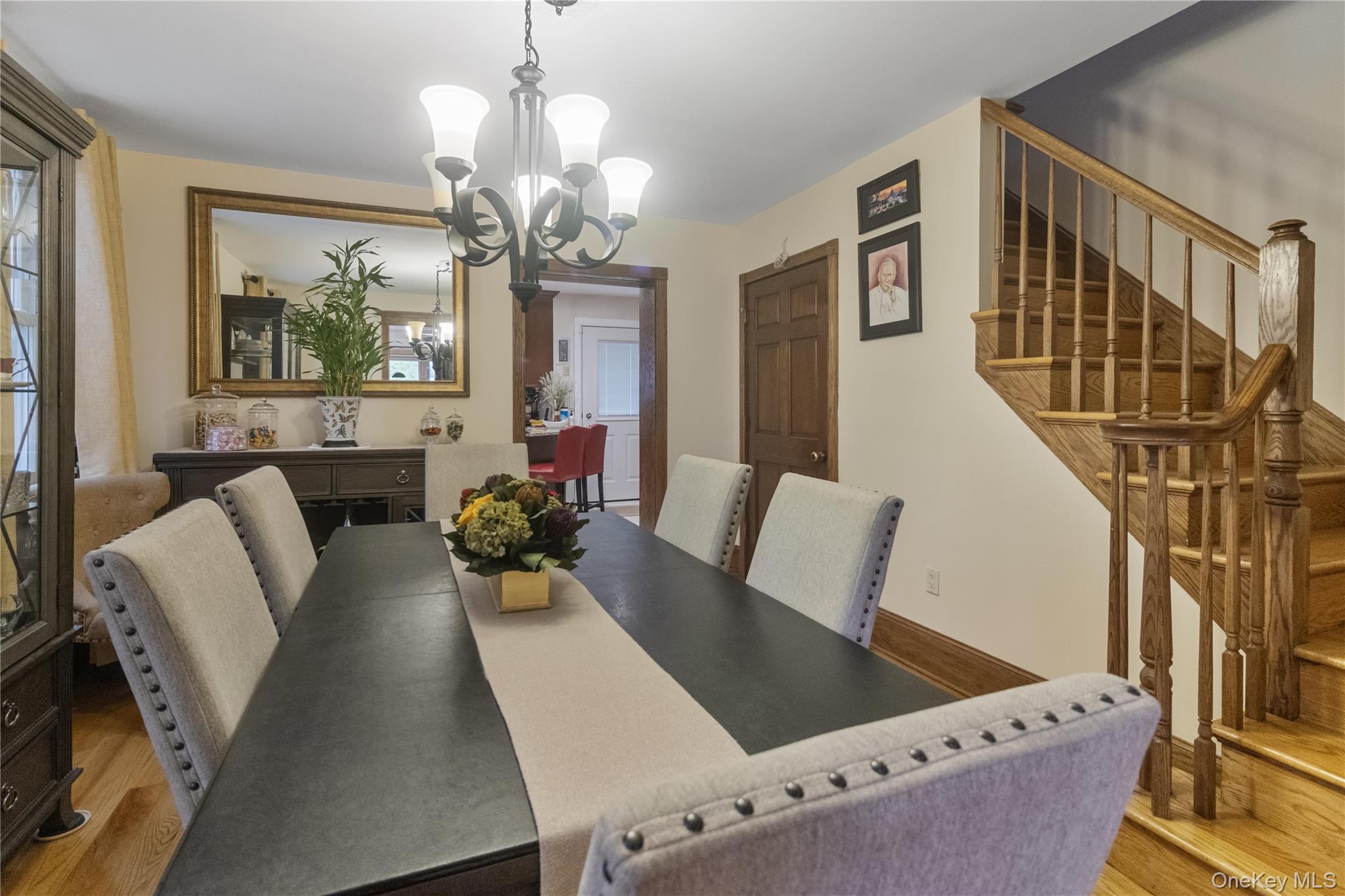 69-24 68th Place Queens, NY 11385 - Photo 7 of 26 a view of a dining room with furniture and a chandelier