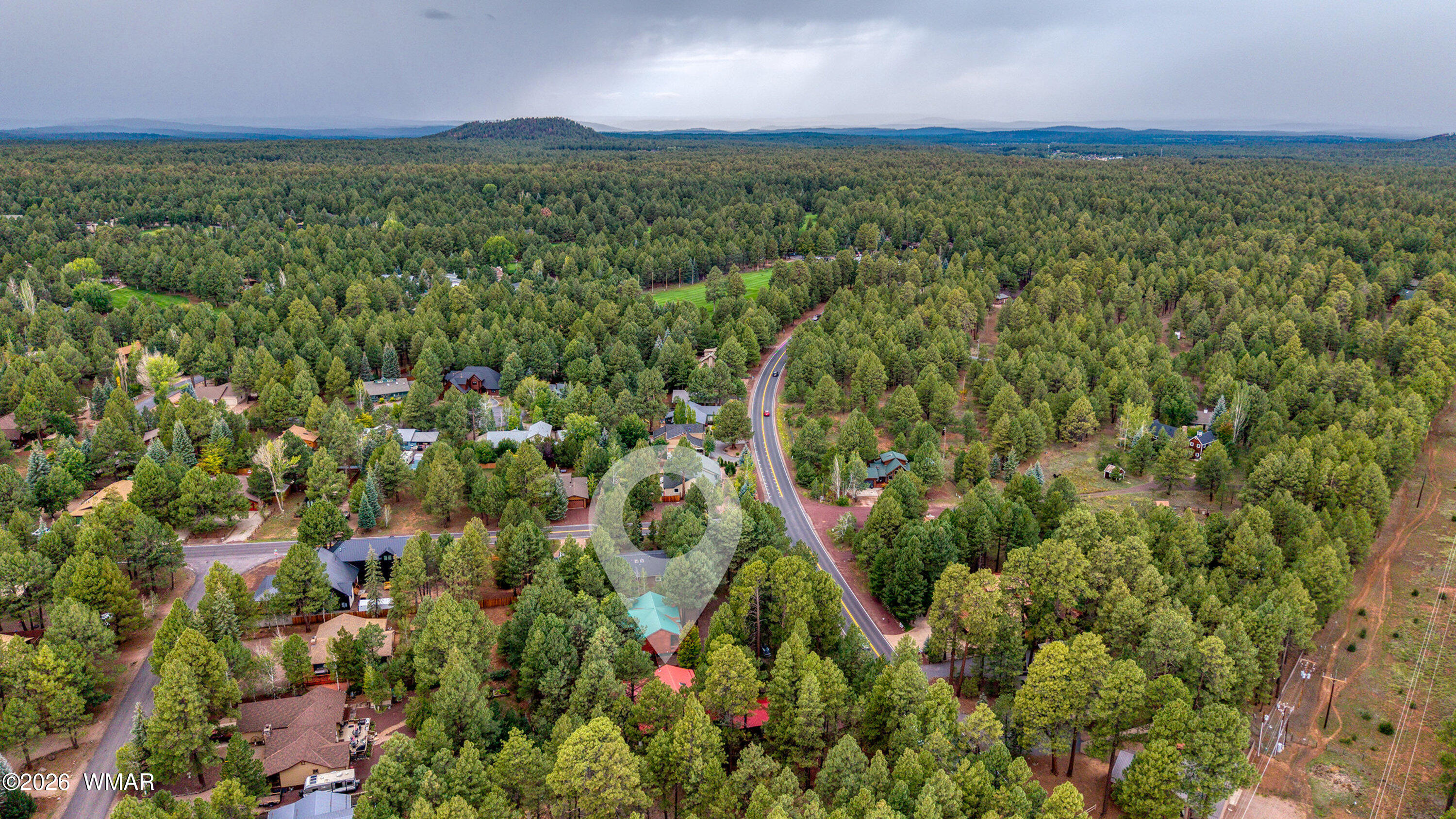 5155 Buck Springs Road Pinetop, AZ 85935 - Photo 36 of 37 a view of a lush green forest with houses and lake view