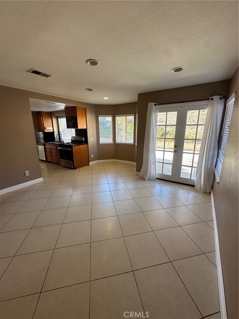 13470 Mallorca Lane Chino Hills, CA 91709 - Photo 11 of 44 a view of a livingroom with a couch and large windows
