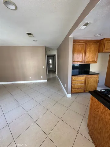 a kitchen with a sink and a stove top oven