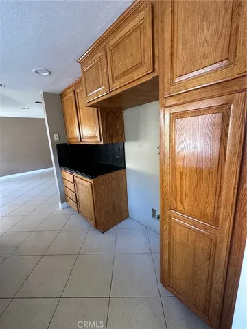 a kitchen with stainless steel appliances a sink stove and cabinets