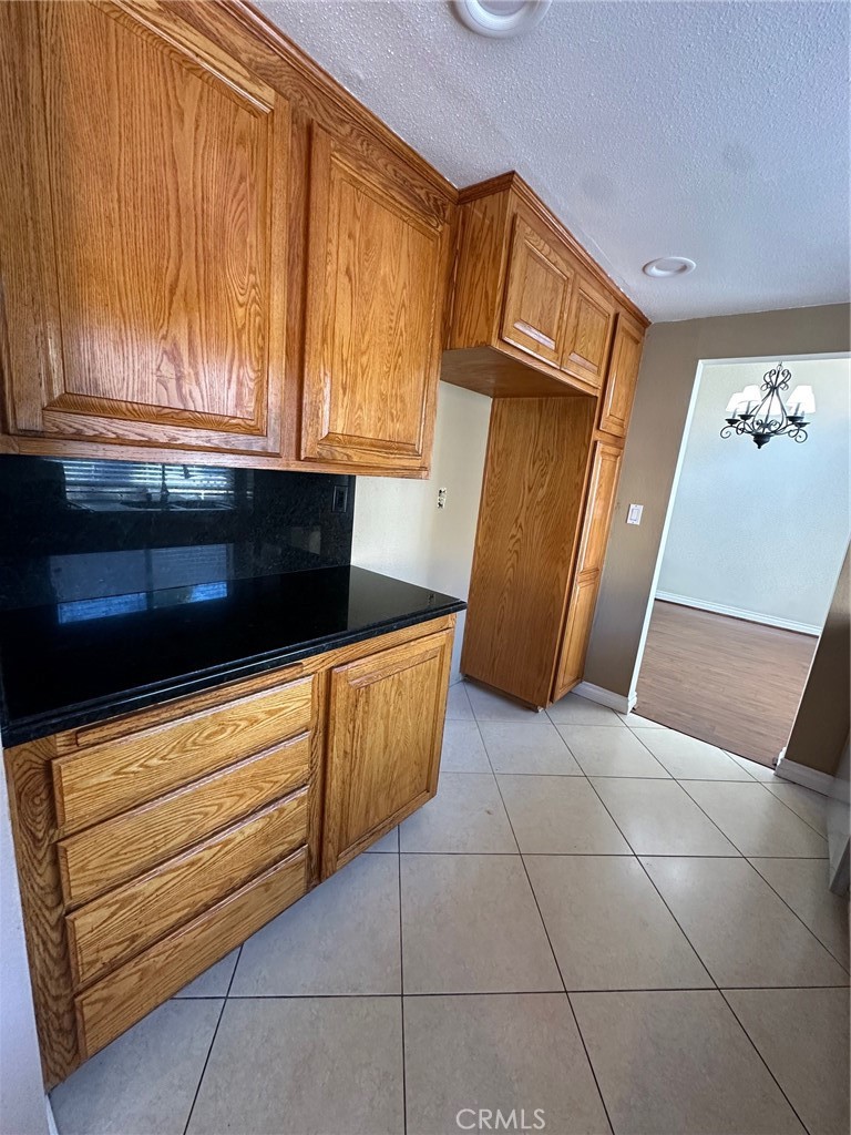13470 Mallorca Lane Chino Hills, CA 91709 - Photo 18 of 44 a kitchen with a sink and cabinets