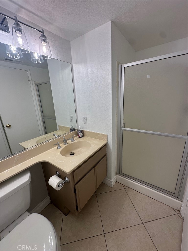 13470 Mallorca Lane Chino Hills, CA 91709 - Photo 23 of 44 a bathroom with a sink a toilet and a mirror