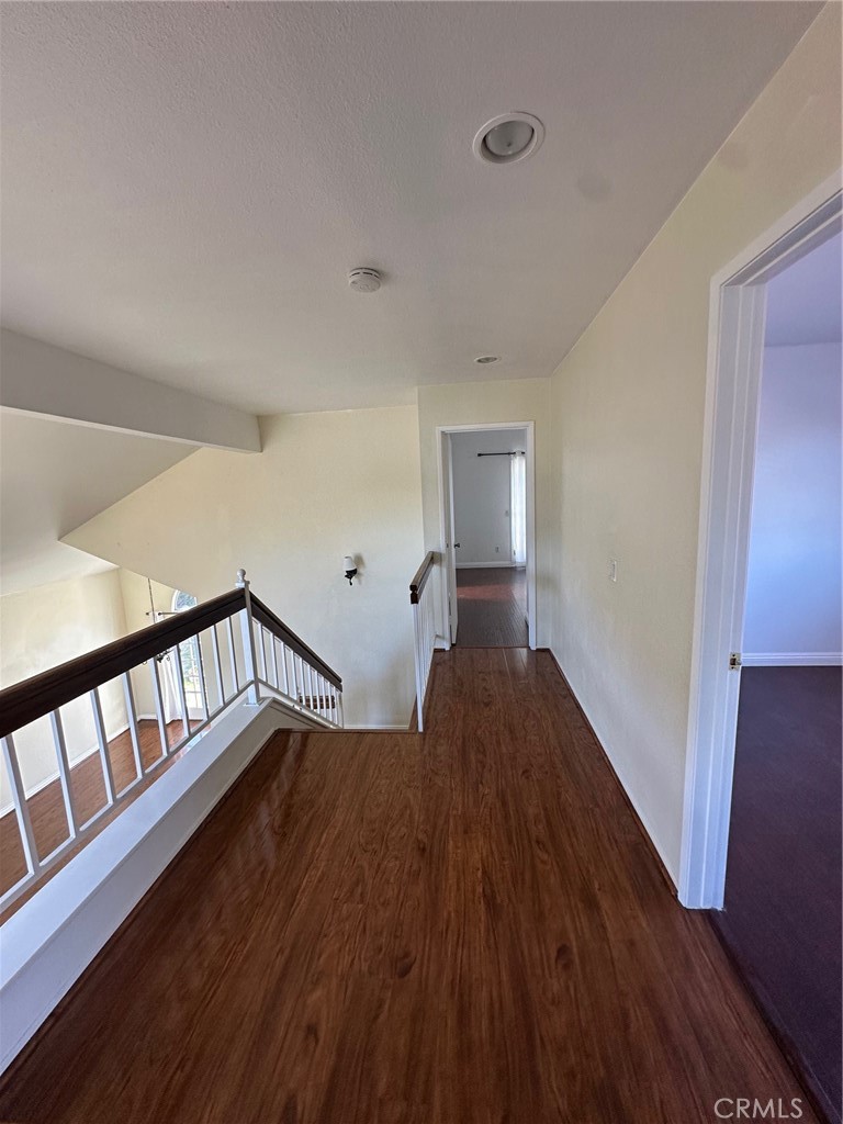 13470 Mallorca Lane Chino Hills, CA 91709 - Photo 25 of 44 a view of hallway with wooden floor