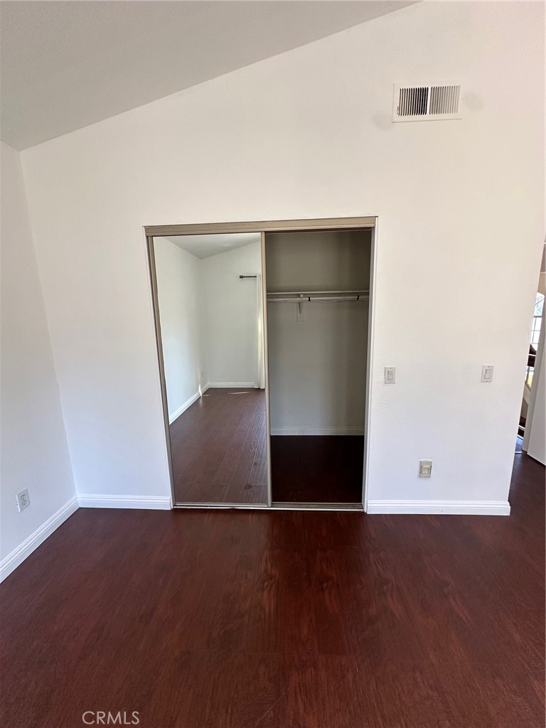 13470 Mallorca Lane Chino Hills, CA 91709 - Photo 27 of 44 an empty room with wooden floor and entrance