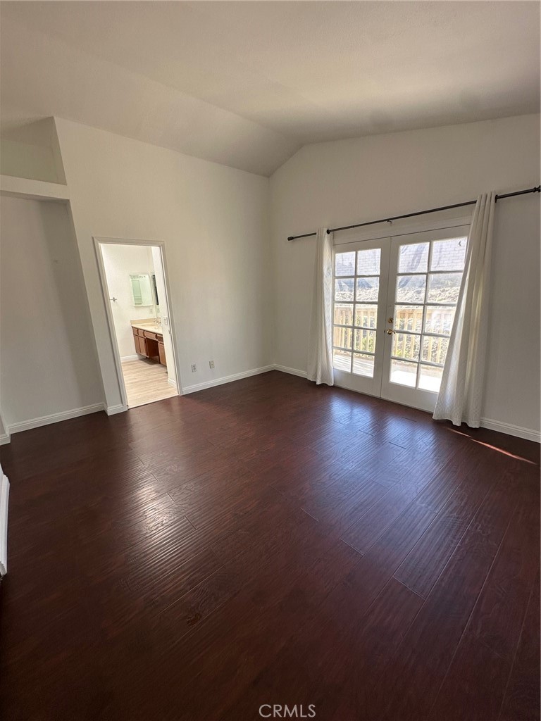 13470 Mallorca Lane Chino Hills, CA 91709 - Photo 29 of 44 an empty room with wooden floor and windows