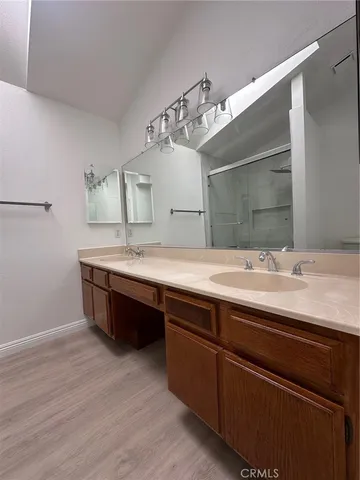 a bathroom with a glass shower door